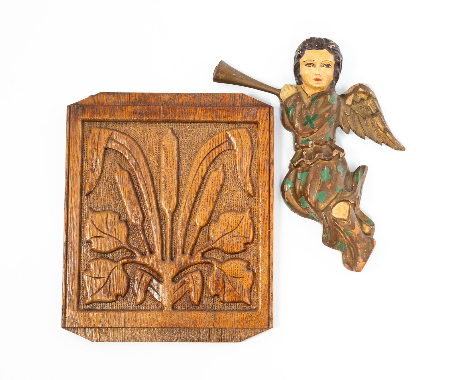TWO FOLKSY CARVED WOOD ITEMS.: TWO FOLKSY CARVED WOOD ITEMS. American, Early 20th Century. An Arts and Crafts panel with incised carved cat tails with a pierced background, 13.25"h. 11"w., and a carved wooden angel holding a