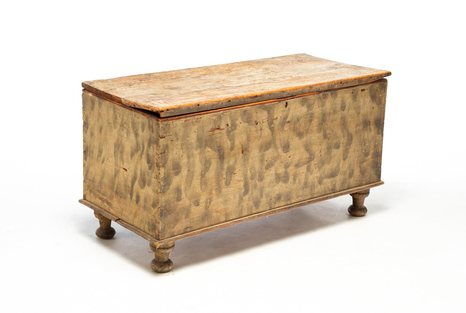 BLANKET CHEST WITH SMOKED PAINT DECORATION.: BLANKET CHEST WITH SMOKED PAINT DECORATION. American, 19th Century. Poplar. Lid with applied edge moldings, dovetailed case, turned legs, and interior till. 22"h. 41.5"w. 18.5"d. Provenance: The