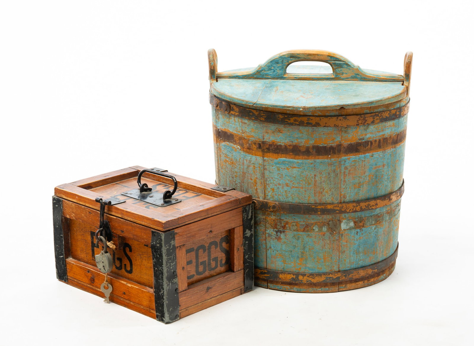 BLUE BUCKET WITH LID AND A PAINTED WOODEN EGG CARRIER.: BLUE BUCKET WITH LID AND A PAINTED WOODEN EGG CARRIER. American, 19th and 20th Centuries. A stave constructed pine bucket with lid, steel hoops, and original light blue paint, 15.25"h. 13.75"d., and a