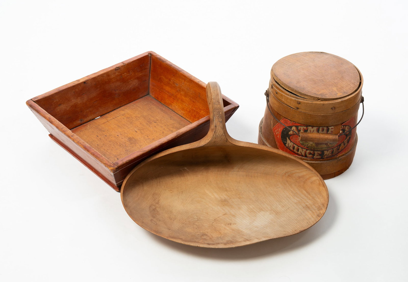 THREE WOODEN HOUSEHOLD ITEMS, INCLUDING A CURD SCOOP.: THREE WOODEN HOUSEHOLD ITEMS, INCLUDING A CURD SCOOP. American, 19th Century. A carved wood curd scoop with incised and hooked handle, 13.5"w., a square apple tray with red finish and white