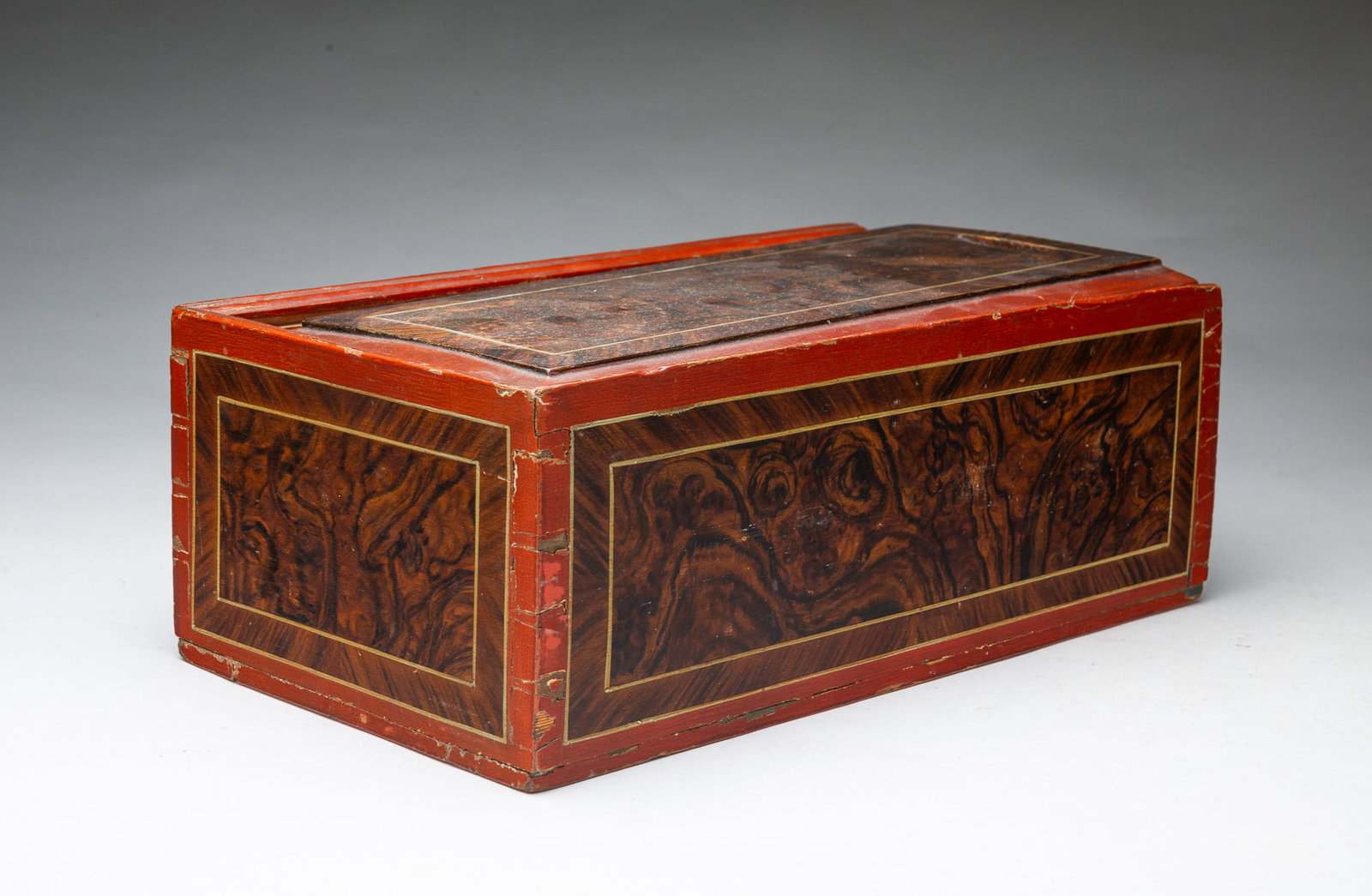 SLIDE LID BOX WITH ORIGINAL GRAIN PAINTED DECORATION, INITIALED AND DATED 1868.: SLIDE LID BOX WITH ORIGINAL GRAIN PAINTED DECORATION, INITIALED AND DATED 1868. American, 19th Century. Pine. The slide lid with a finger notch, painted red with central panel of brown burl