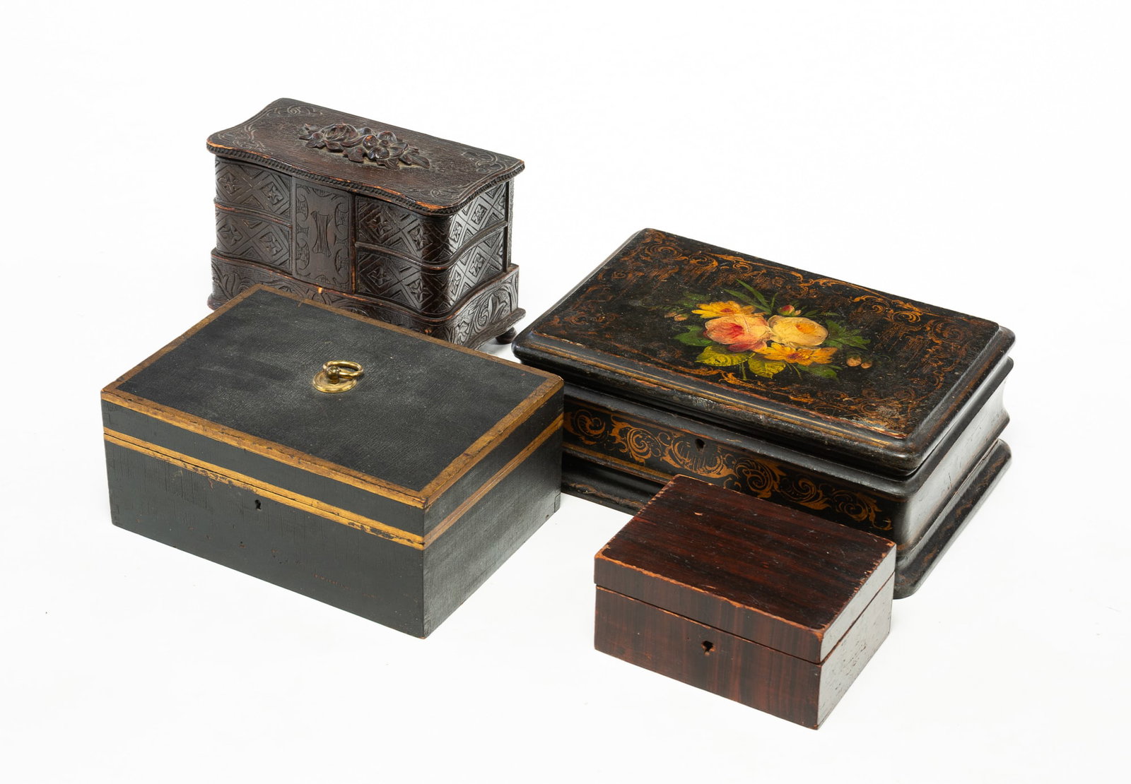 FOUR WOODEN BOXES.: FOUR WOODEN BOXES. American, 19th Century. A carved pine jewelry box with four swiveling drawers, rose carved lid and turned legs, 6"h. 8.5"w. 4.5"d., Victorian box with felt-lined interior, black