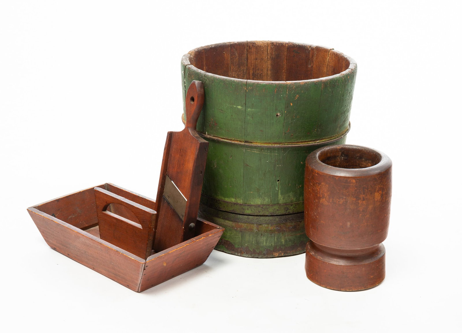 FOUR WOODENWARE ITEMS.: FOUR WOODENWARE ITEMS. American, 19th Century. Turned maple mortar with original red-brown wash, 8"h., a pine carry-all with canted sides and handle with half round cut-out handle, 4"h. 11.25"w.