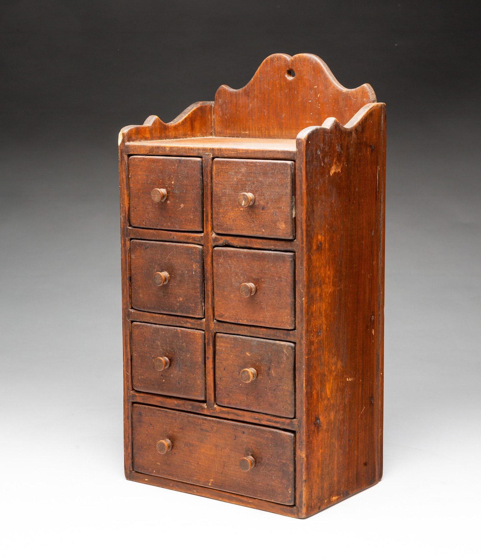 BROWN-WASHED SEVEN-DRAWER HANGING SPICE BOX. (1 of 5)