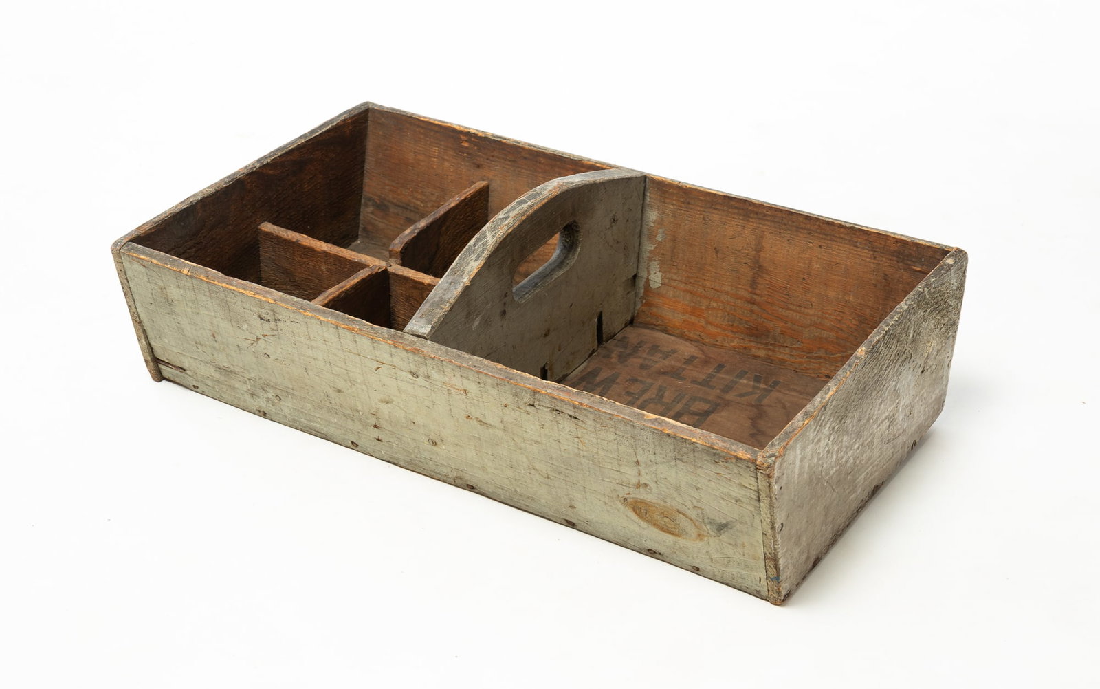 GRAY-PAINTED PINE CARRIER.: GRAY-PAINTED PINE CARRIER. American, 20th Century. Of rectangular form with canted sides, a central handle, and one fitted section with four compartments. 6.5"h. 21.75"w. 13"d.