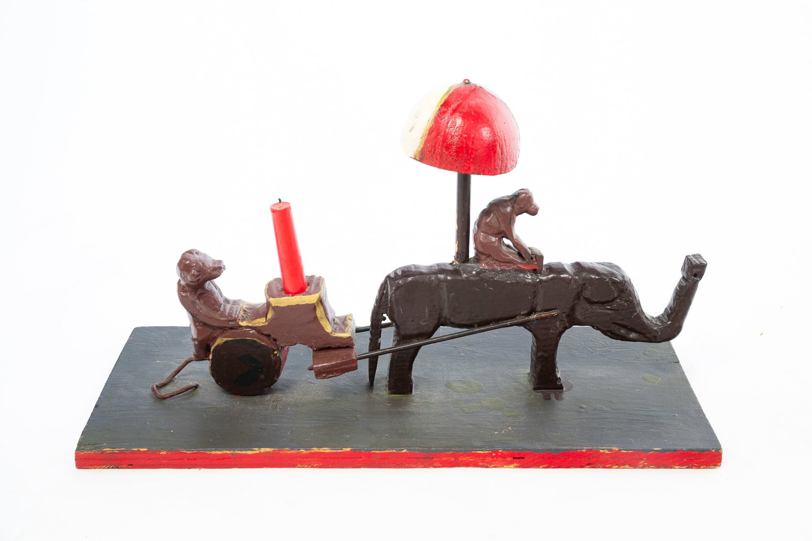 JOSEPHUS FARMER (AMERICAN, 1894-1989) "MONKEY AND ELEPHANT" FOLK ART CARVING.: JOSEPHUS FARMER (AMERICAN, 1894-1989) "MONKEY AND ELEPHANT" FOLK ART CARVING. American, 20th Century. Mixed media. Carved wood and wire with original paint. Elephant carrying a monkey and an umbrella 