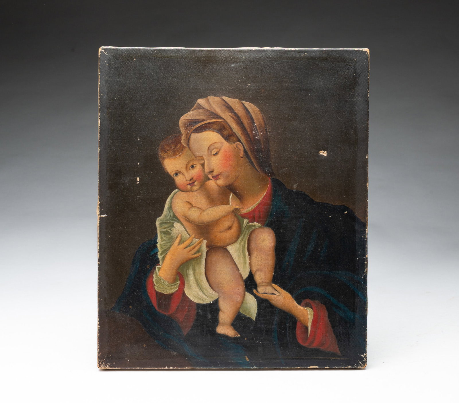OIL ON CANVAS OF THE MADONNA AND CHILD.: OIL ON CANVAS OF THE MADONNA AND CHILD. American or European, 19th Century. Depicting Mary holding the baby Jesus in a loving embrace. Unframed. 12"h. 10.25"w.