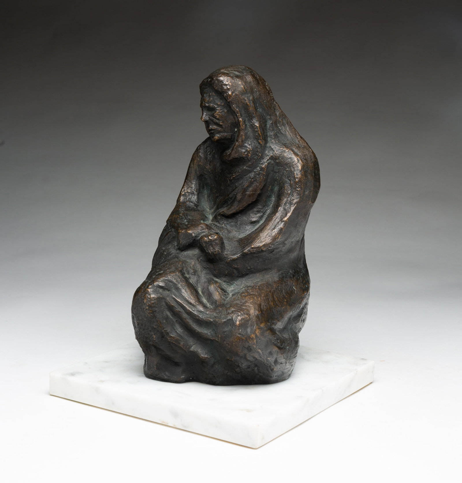 FIGURAL BRONZE SCLUPTURE OF A SEATED WOMAN.: FIGURAL BRONZE SCLUPTURE OF A SEATED WOMAN. American, 20th Century. Depicting a cloaked woman in a crouched position. Mounted on a square marble base. Unsigned. 10.75"h. 8" square. Provenance: The Lif