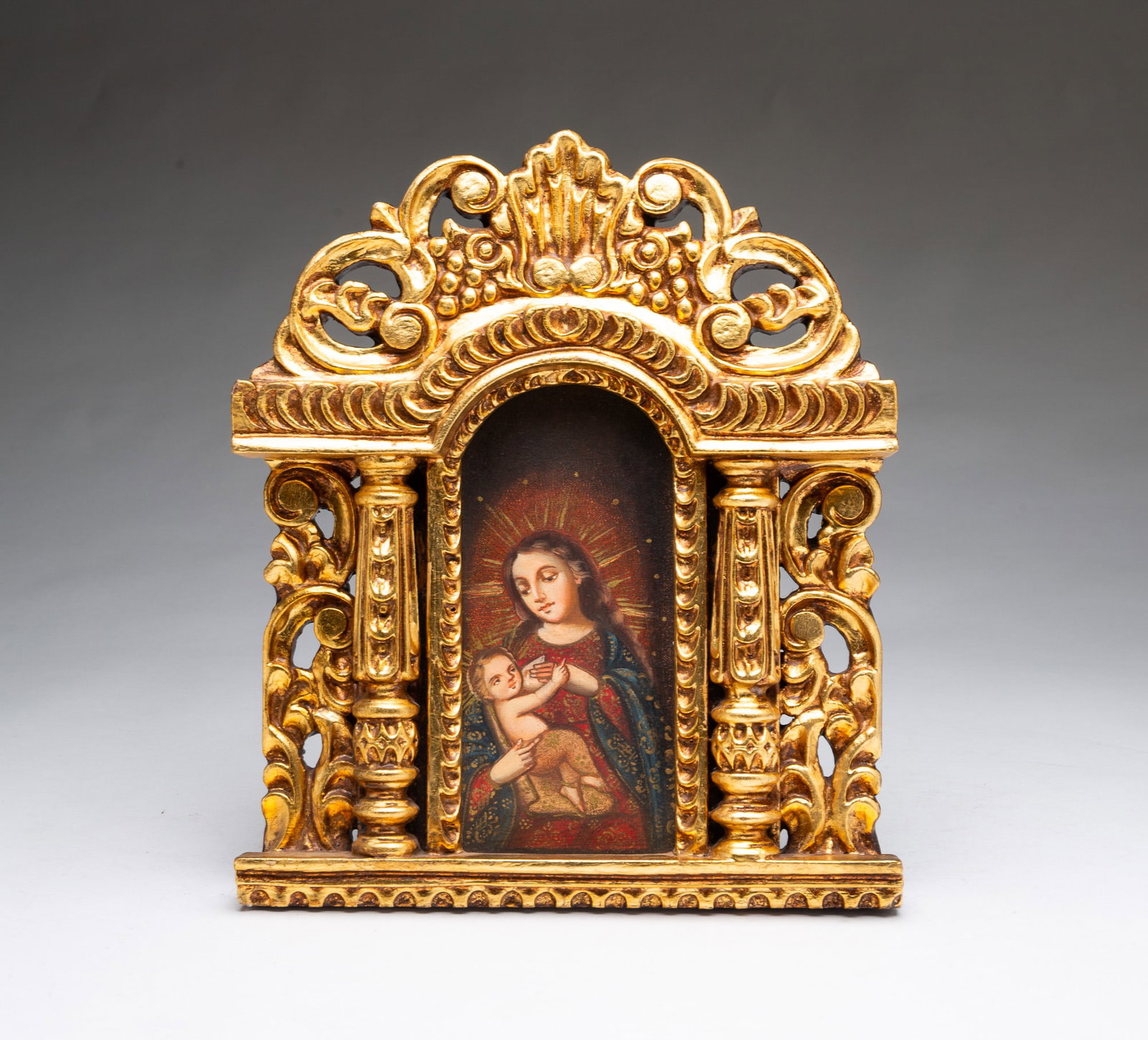 PERUVIAN CUZCO-STYLE OIL ON CANVAS OF MADONNA AND CHILD IN CARVED GILT FRAME. (1 of 4)