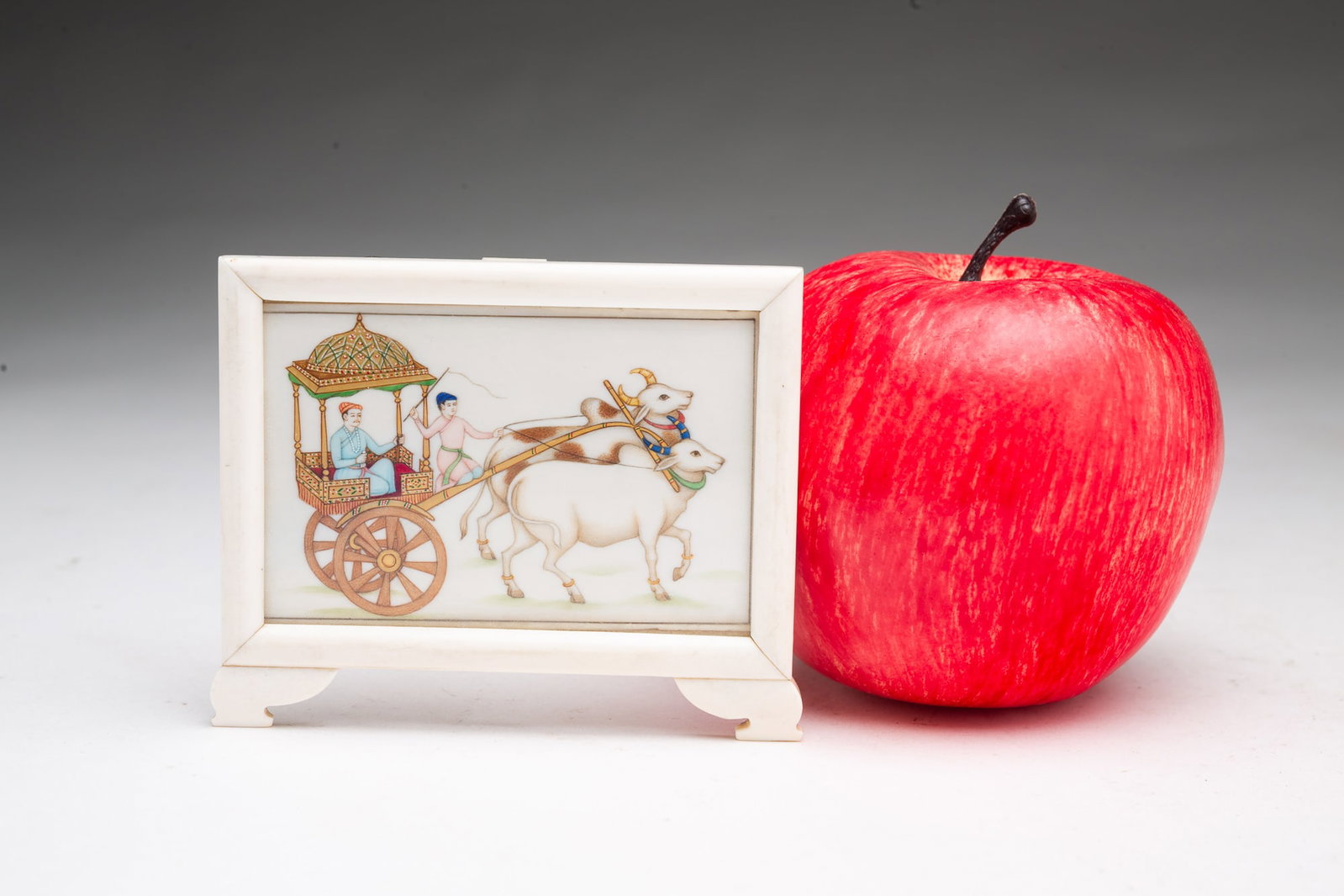 MINIATURE MUGHAL PAINTING IN A FINE BONE FRAME. (1 of 4)