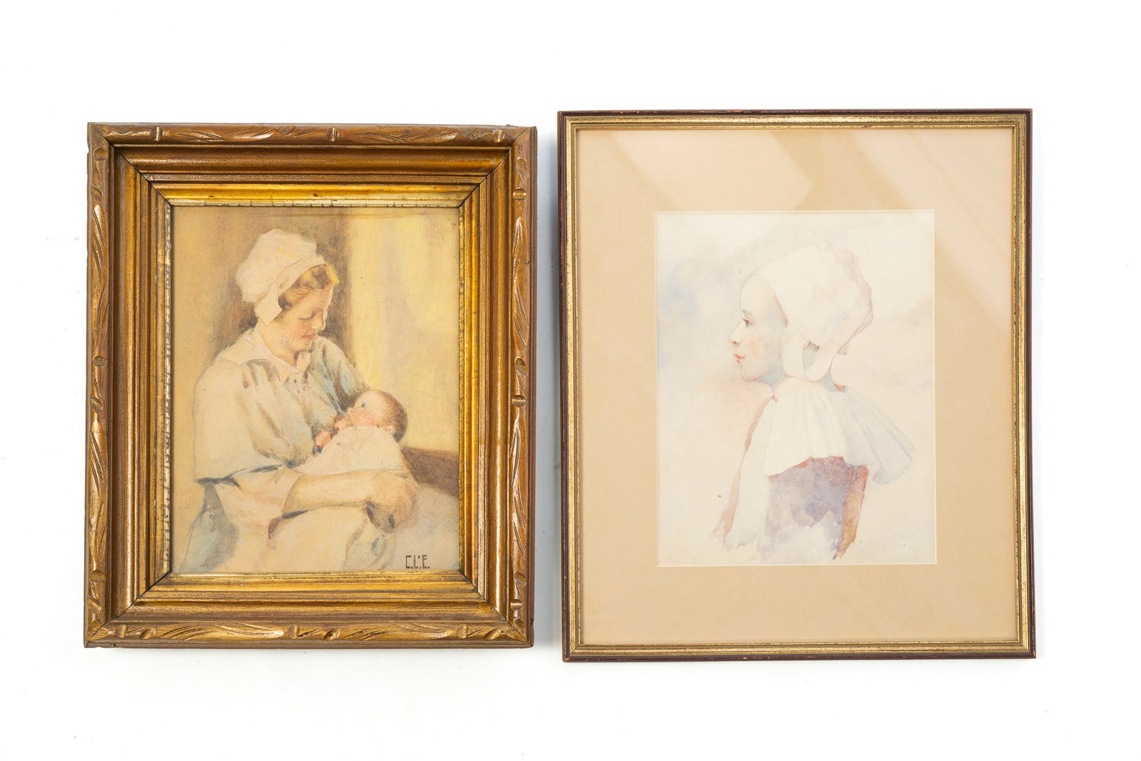 TWO WATERCOLORS.: TWO WATERCOLORS. American and/or European, 19th or 20th Century. The first depicting a nurse holding an infant, signed "C.L.E." at lower right, with an illegible inscription on frame verso. The