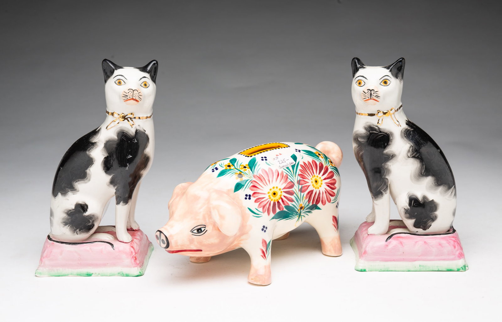 PAIR OF SEATED STAFFORDSHIRE CATS AND A QUIMPER PIG BANK. (1 of 7)