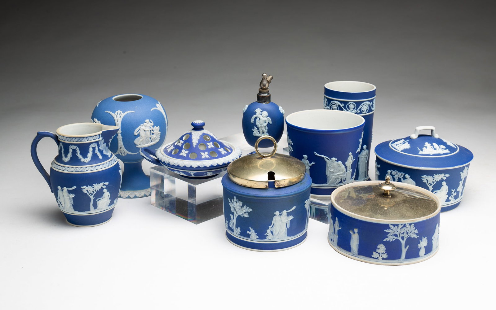 GROUP OF ENGLISH WEDGWOOD BLUE DIP JASPERWARE ITEMS.: GROUP OF ENGLISH WEDGWOOD BLUE DIP JASPERWARE ITEMS. English, 19th and early 20th Centuries. A mixture of impressed WEDGWOOD and WEDGWOOD ENGLAND marks. A light blue rose bowl on pedestal, 4.25"h. The