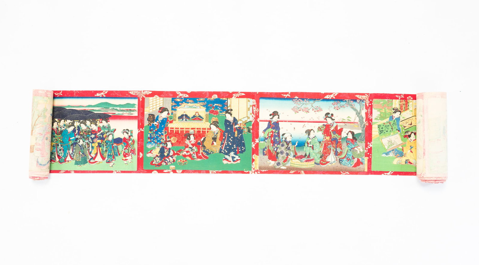 JAPANESE WOODBLOCK PRINT SCROLL.: JAPANESE WOODBLOCK PRINT SCROLL. Japan, 19th Century. Ink on rice paper. 24-foot long scroll featuring beauties in traditional dress taking part in everyday scenes. 6.75"h.