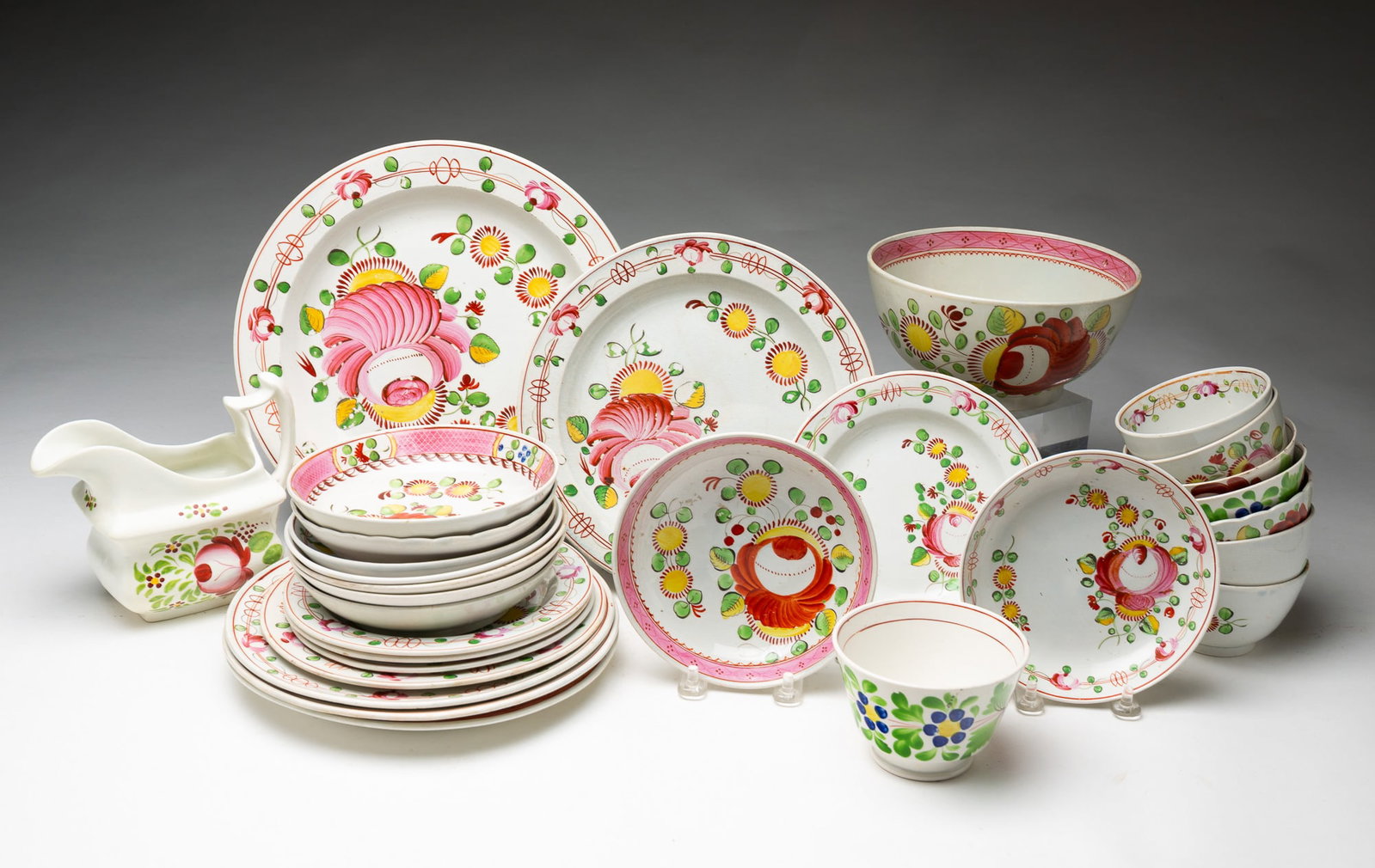 GROUP OF GAUDY DUTCH SOFT PASTE PORCELAIN.: GROUP OF GAUDY DUTCH SOFT PASTE PORCELAIN. England, 19th Century. Includes plates, a bowl, handleless cups and saucers, and a creamer. All in vibrant polychrome decoration. Bowl, 3"h. 6.5"d.