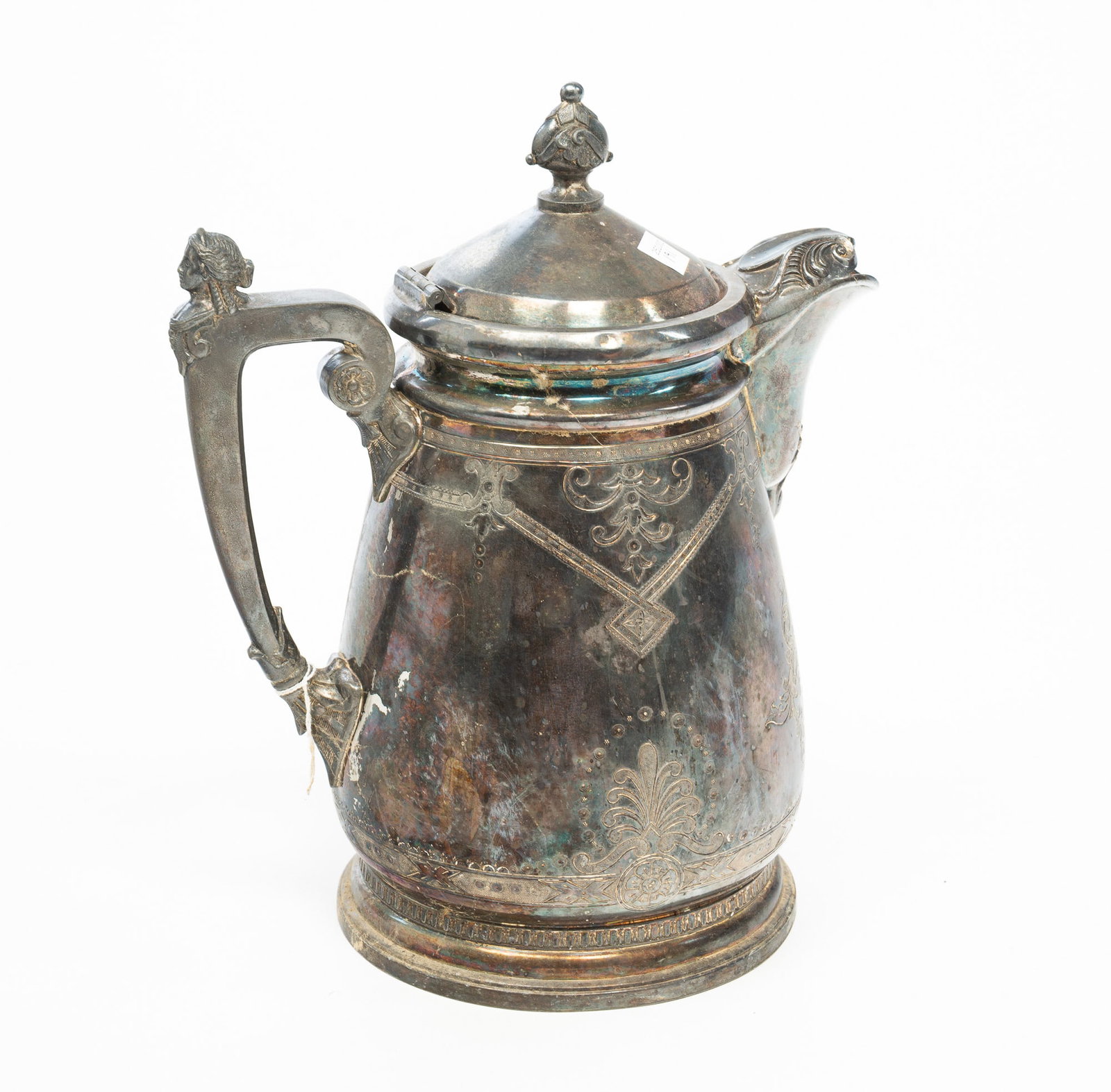 PARKER CASPER & CO. (WEST MERIDIAN, CONNECTICUT) SILVER PLATE INSULATED WATER PITCHER.: PARKER CASPER & CO. (WEST MERIDIAN, CONNECTICUT) SILVER PLATE INSULATED WATER PITCHER. American, Third quarter 19th Century. Of ovoid form, the hinged lid with a scrolled bud finial, a stylized