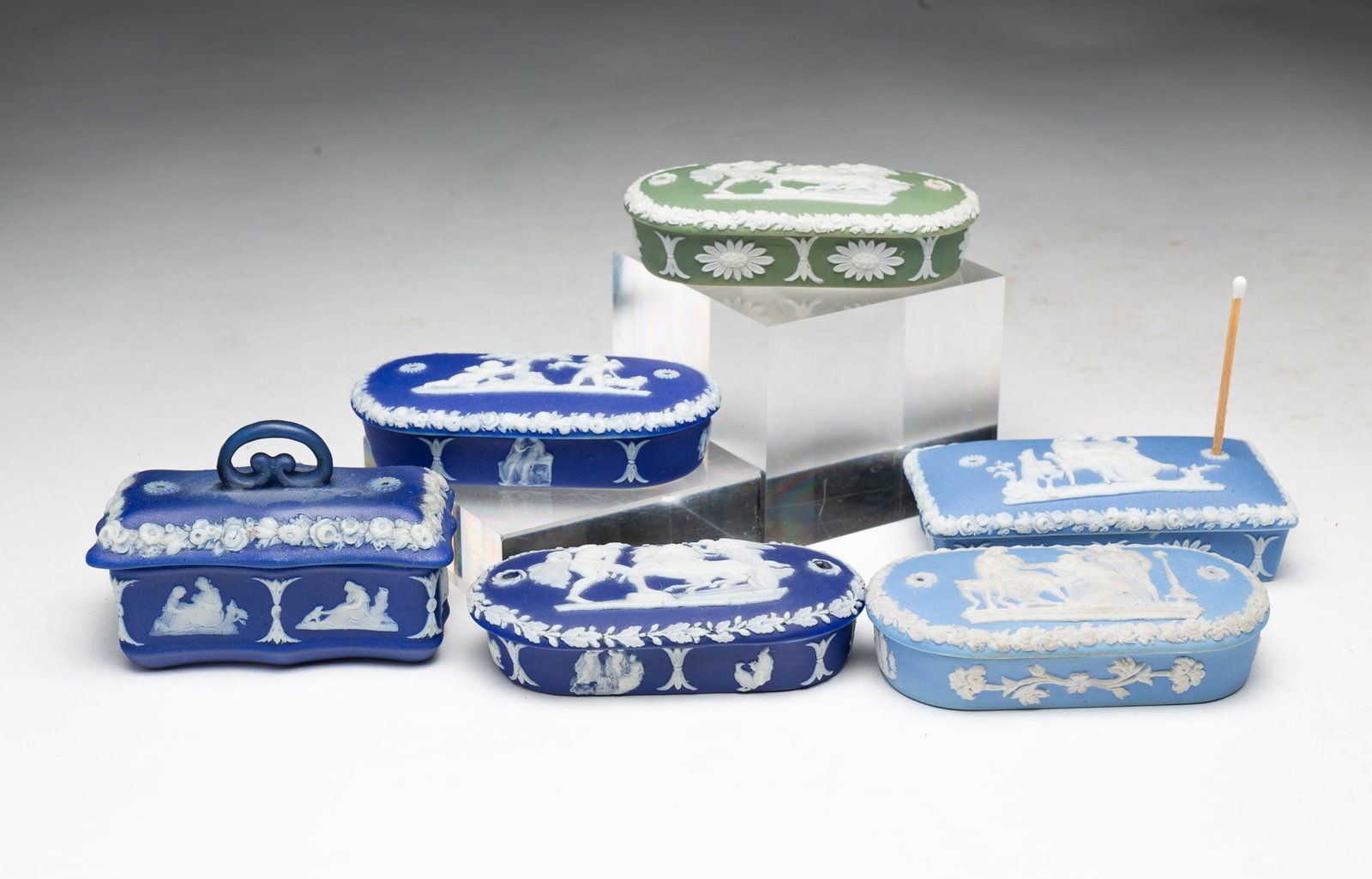 GROUP OF DIP JASPERWARE MATCH SAFE (GOING-TO-BED) BOXES.: GROUP OF DIP JASPERWARE MATCH SAFE (GOING-TO-BED) BOXES. English, mid 19th Century. All five impressed WEDGWOOD. All five have strikers under the lids. Three are dark blue, two light blue, and one sag
