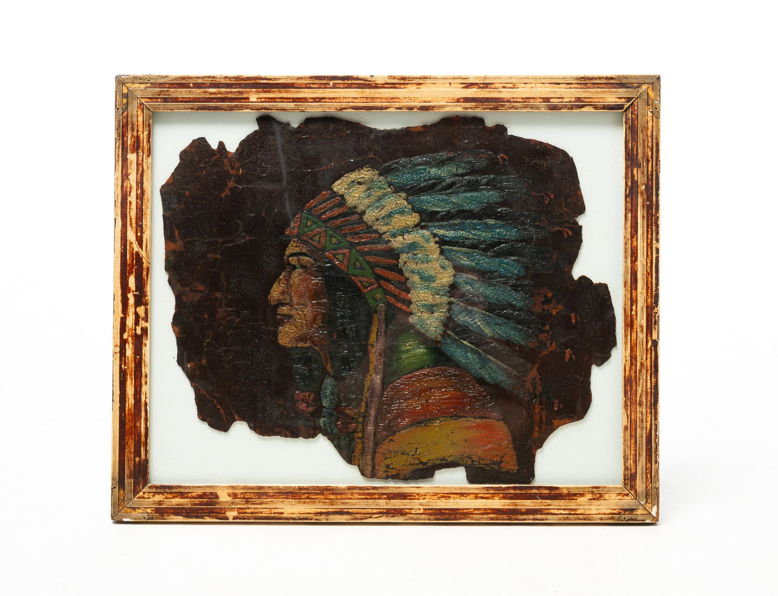 PAINTED AND EMBOSSED NATIVE AMERICAN CHIEF PORTRAIT ON LEATHER TIPI FRAGMENT.: PAINTED AND EMBOSSED NATIVE AMERICAN CHIEF PORTRAIT ON LEATHER TIPI FRAGMENT. American, Late 19th or Early 20th Century. Polychrome pigment. Profile portrait of a Native American chief wearing a