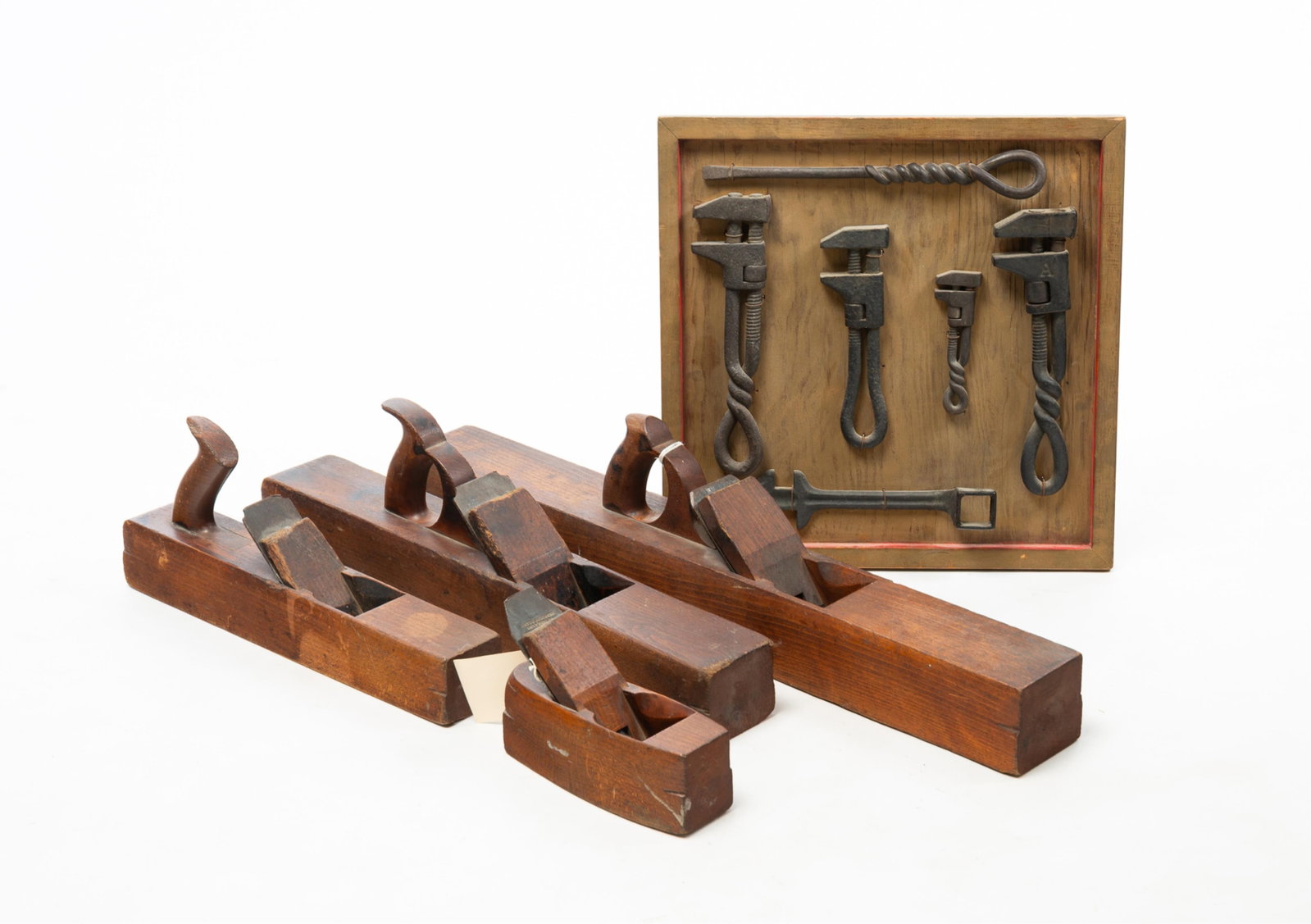 GROUP OF ANTIQUE TOOLS.: GROUP OF ANTIQUE TOOLS. American, 19th Century. Four planes by Leavitte Gardner (Boston, Massachusetts, 1825-1850), 28" jointer, 22" jack, 16" bench, and an 8" block. Together with a frame of six