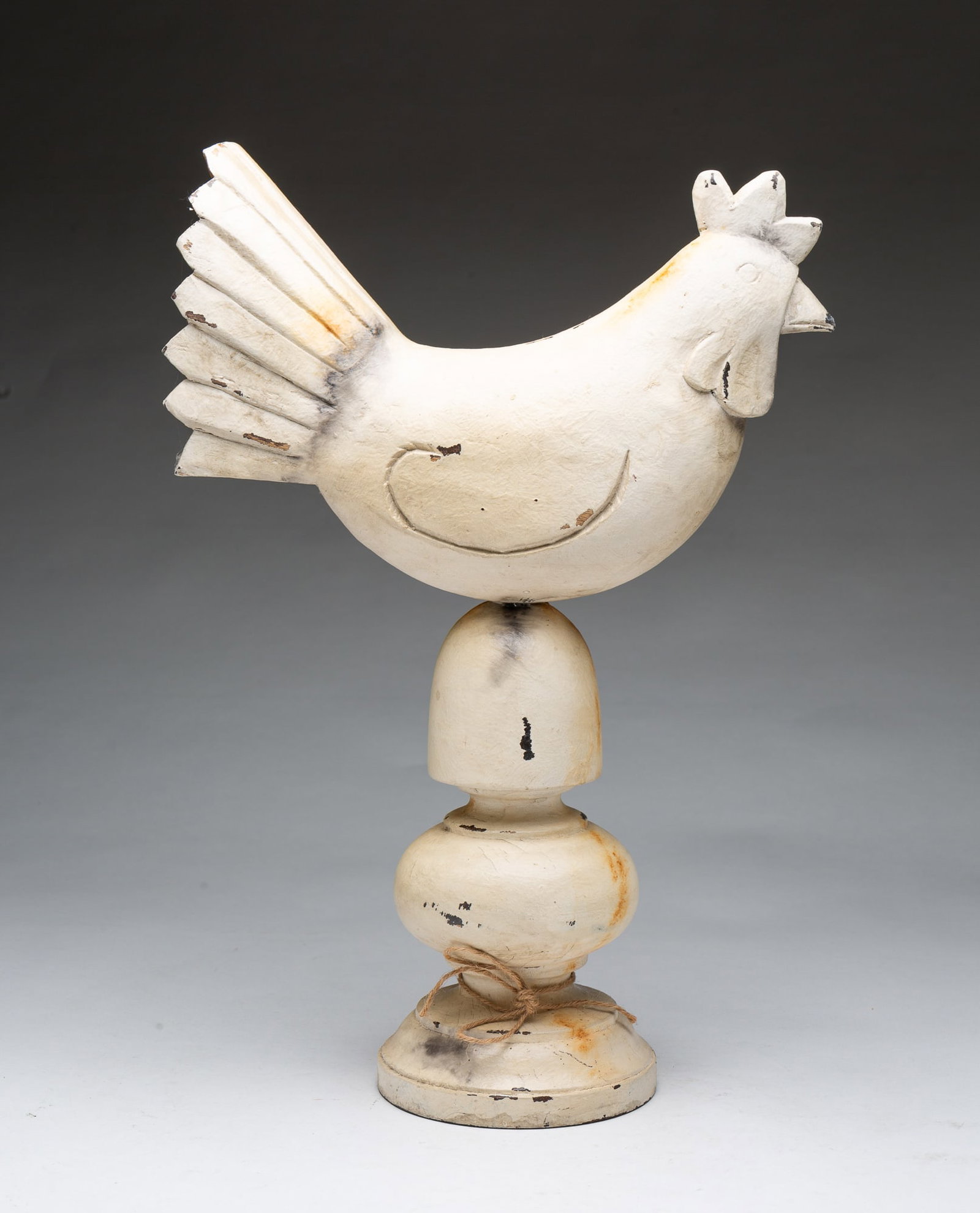 PAINTED AND CARVED WOODEN ROOSTER ON TURNED BASE.: PAINTED AND CARVED WOODEN ROOSTER ON TURNED BASE. American, 20th Century. Smooth carvings and a distressed white-painted finish with intentional wear to highlight its character. The rooster features