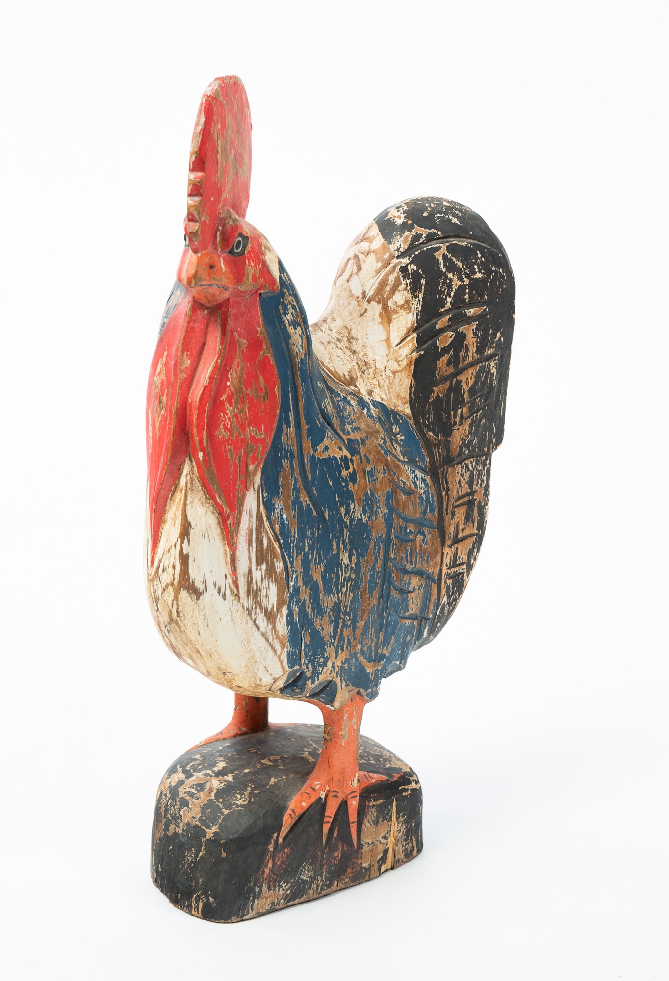 FOLK ART CARVED AND PAINT-DECORATED ROOSTER.: FOLK ART CARVED AND PAINT-DECORATED ROOSTER. 20th Century. Wood. With carved and painted features in shades of red, white, blue, and black; including a raised comb and wattles below the beak. 20"h. Pr