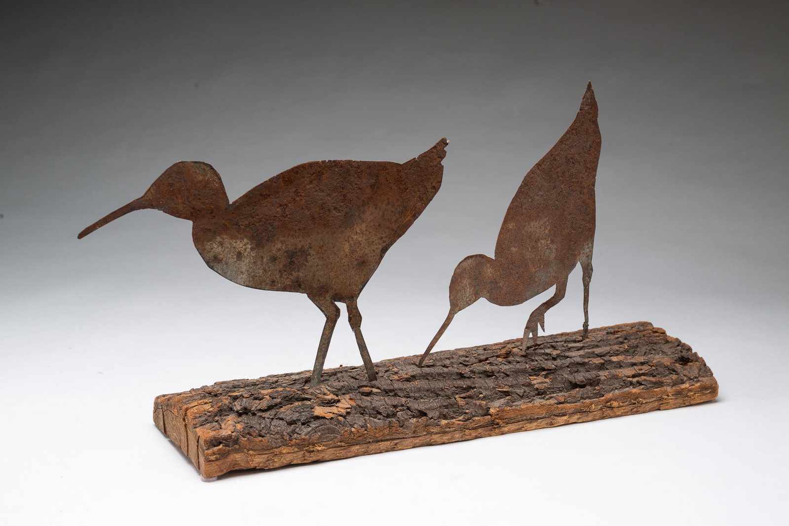 TWO SHEET METAL SHORE BIRDS MOUNTED ON BARK. (1 of 4)
