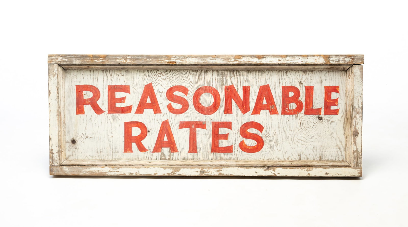 DOUBLE-SIDED "REASONABLE RATES" PAINTED WOODEN TRADE SIGN.: DOUBLE-SIDED "REASONABLE RATES" PAINTED WOODEN TRADE SIGN. American, Early 20th Century. Pine. Red-painted letters on a white ground with white framing. 19.5"h. 50.5"w. 2.5"d.