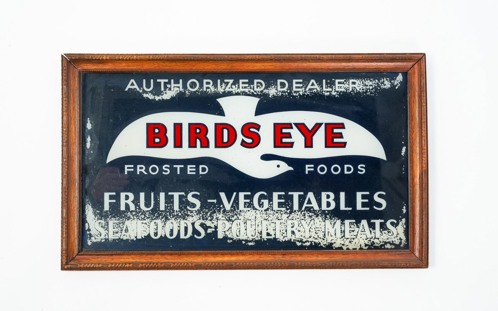BIRDS EYE FROSTED FOODS REVERSE-PAINTED GLASS AUTHORIZED DEALER SIGN.: BIRDS EYE FROSTED FOODS REVERSE-PAINTED GLASS AUTHORIZED DEALER SIGN. American, 20th Century. Depicting a white bird against a blue ground and reading "AUTHORIZED DEALER / BIRDS EYE / FROSTED FOODS /