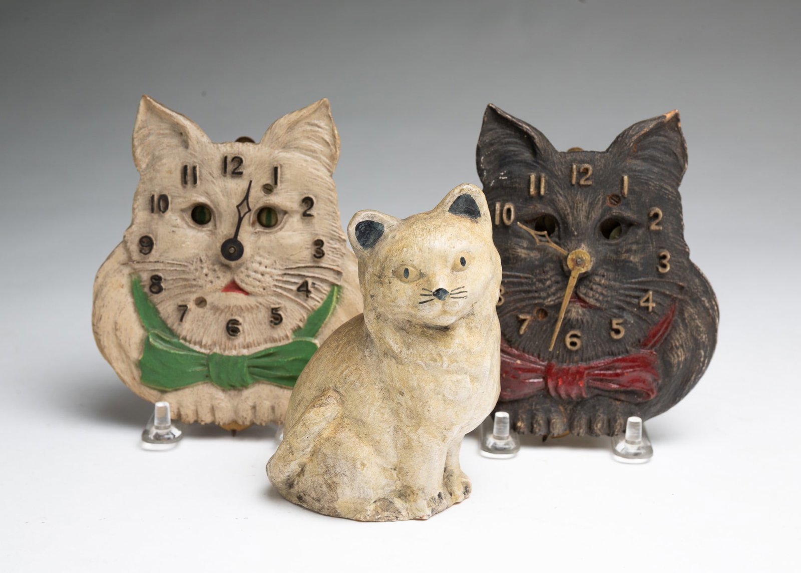 TWO LUX PENDULETTE CAT CLOCKS AND CHALKWARE CAT FIGURINE. (1 of 6)
