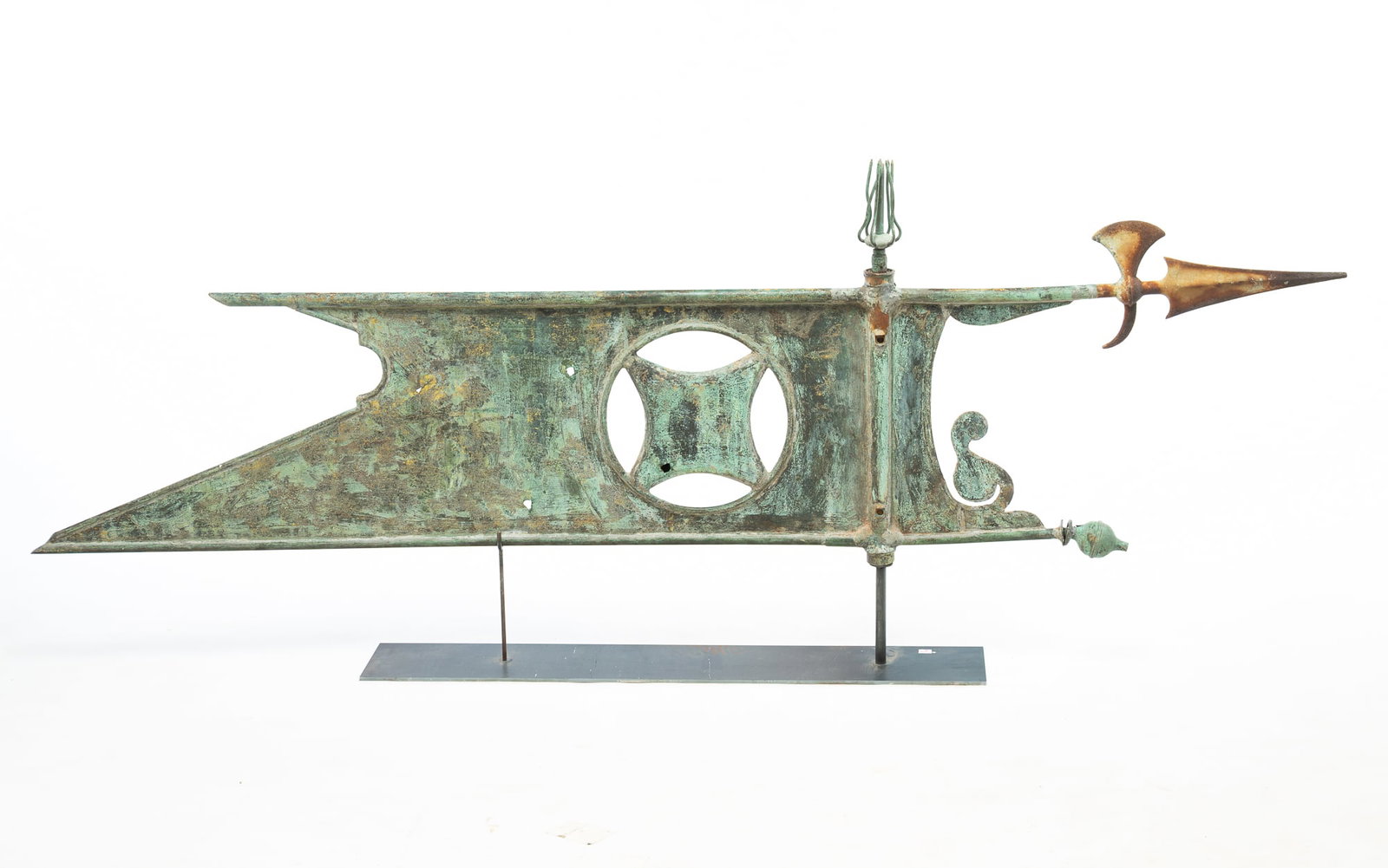 LARGE BANNER STYLE WEATHERVANE.: LARGE BANNER STYLE WEATHERVANE. American, 19th Century. Copper. Banner form with axe and spear at front, pennant at the back, and a square inside a circle in middle. On a contemporary stand, 23.5"h.