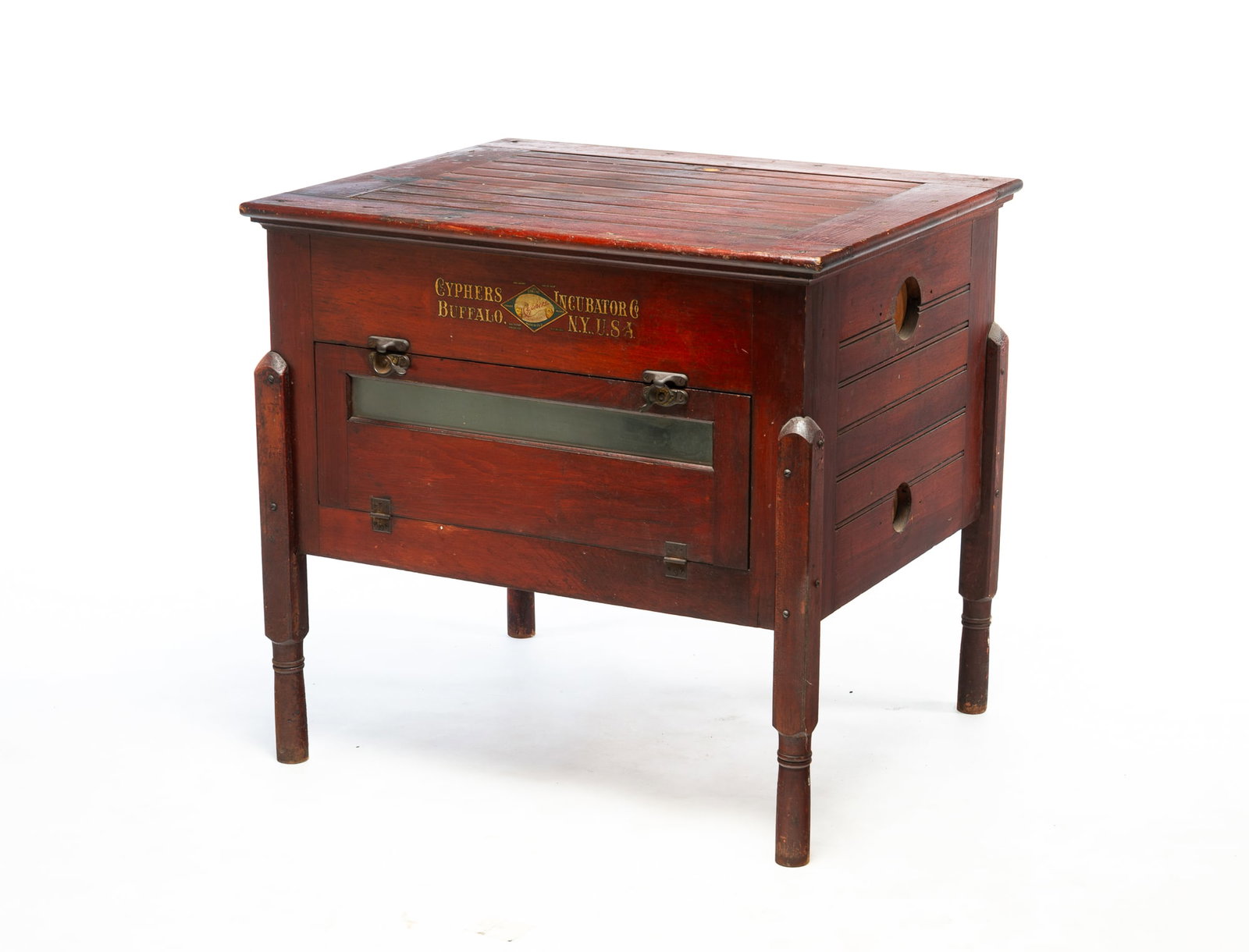 CYPHERS INCUBATOR COMPANY, BUFFALO, NEW YORK INCUBATOR.: CYPHERS INCUBATOR COMPANY, BUFFALO, NEW YORK INCUBATOR. American, Early 20th Century. Pine. Bead board top and sides, turned legs, hinged front door, original red finish, and decal label. 32"h. 34"w.