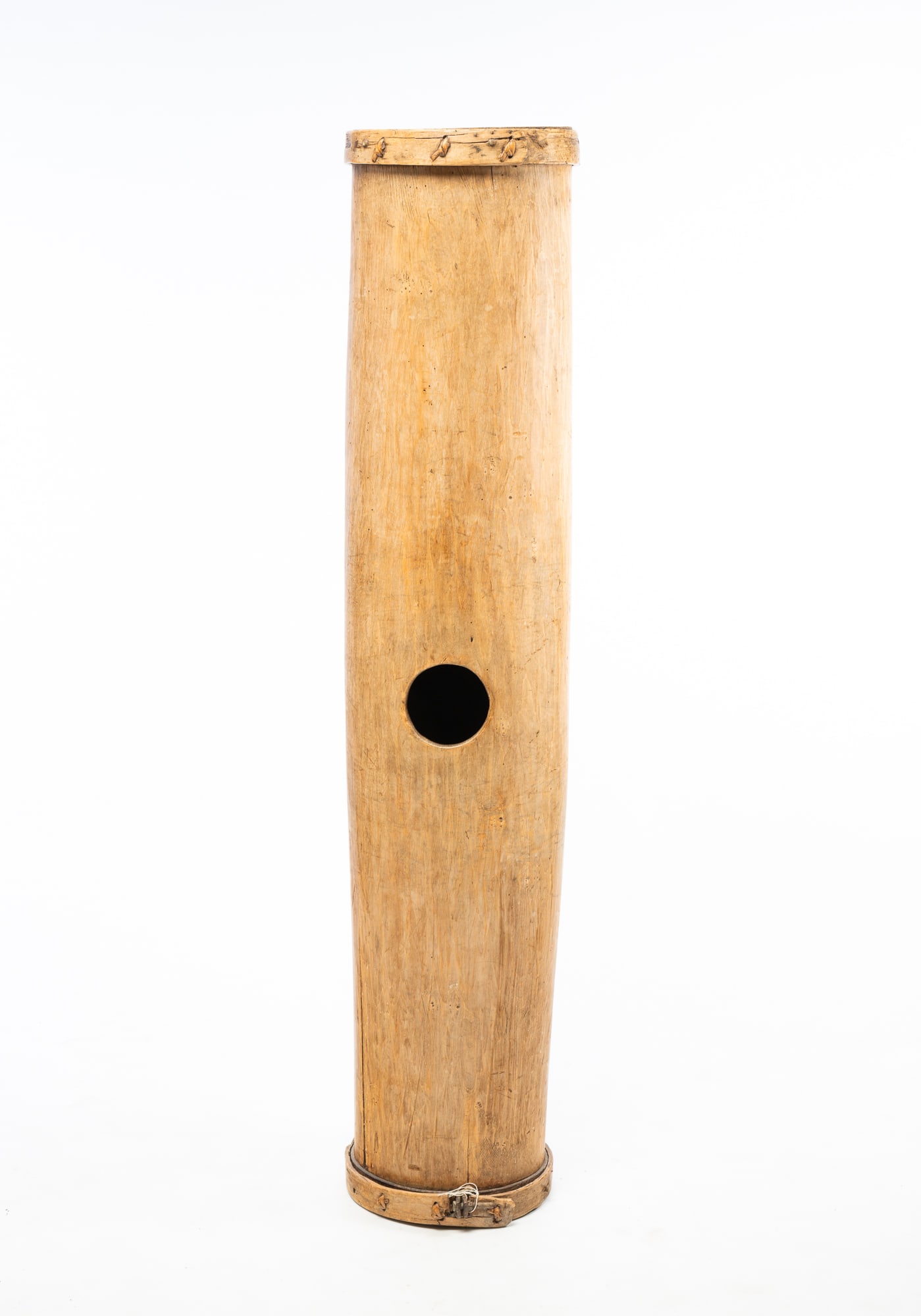 PRIMITIVE SOFT CHEESE MAKER.: PRIMITIVE SOFT CHEESE MAKER. American, 19th Century. Cylindrical shape made from a hollowed-out sycamore log, center round opening, and bentwood caps. 55"h. 11"d. Provenance: The Lifetime Collection