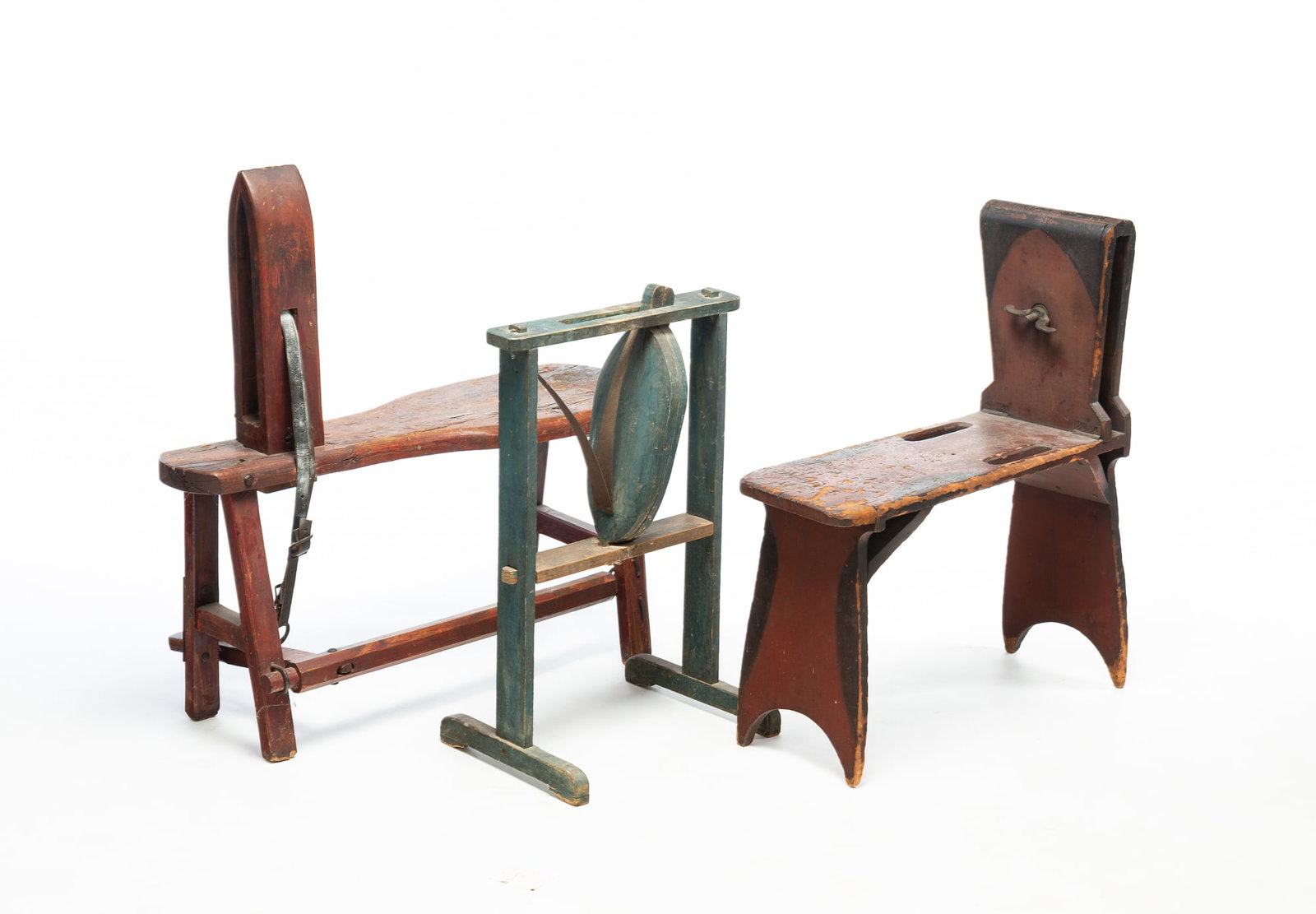THREE HARNESS MAKERS LEATHER CLAMPS.: THREE HARNESS MAKERS LEATHER CLAMPS. American, 19th Century. One with original blue paint, mortised frame, shoe feet, and steel spring, 27"h. 17.5"w. 12.25"d., bench clamp with rust red and black