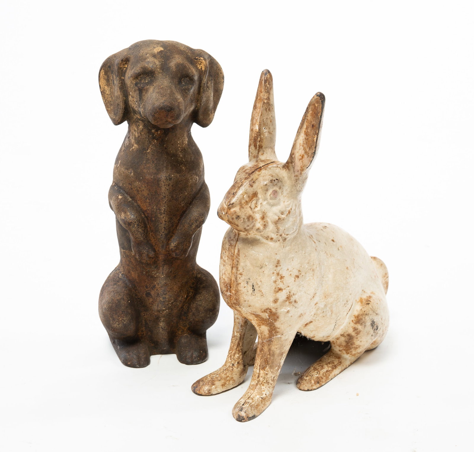 TWO CAST IRON DOORSTOPS. (1 of 3)