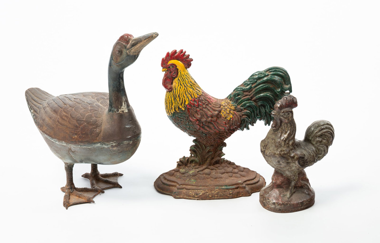 THREE CAST IRON BIRD DOORSTOPS. (1 of 6)