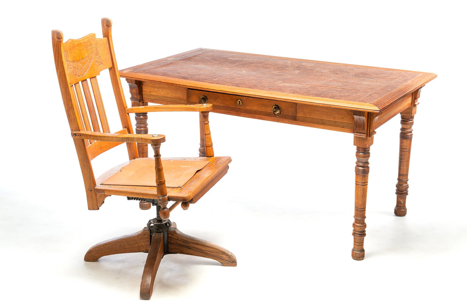 EASTLAKE VICTORIAN LIBRARY TABLE AND DESK CHAIR.: EASTLAKE VICTORIAN LIBRARY TABLE AND DESK CHAIR. American, Late 19th Century. Walnut table with faux leather textured insert on top, dovetailed drawer, and turned legs, 29.5"h. 54"w., and an oak press