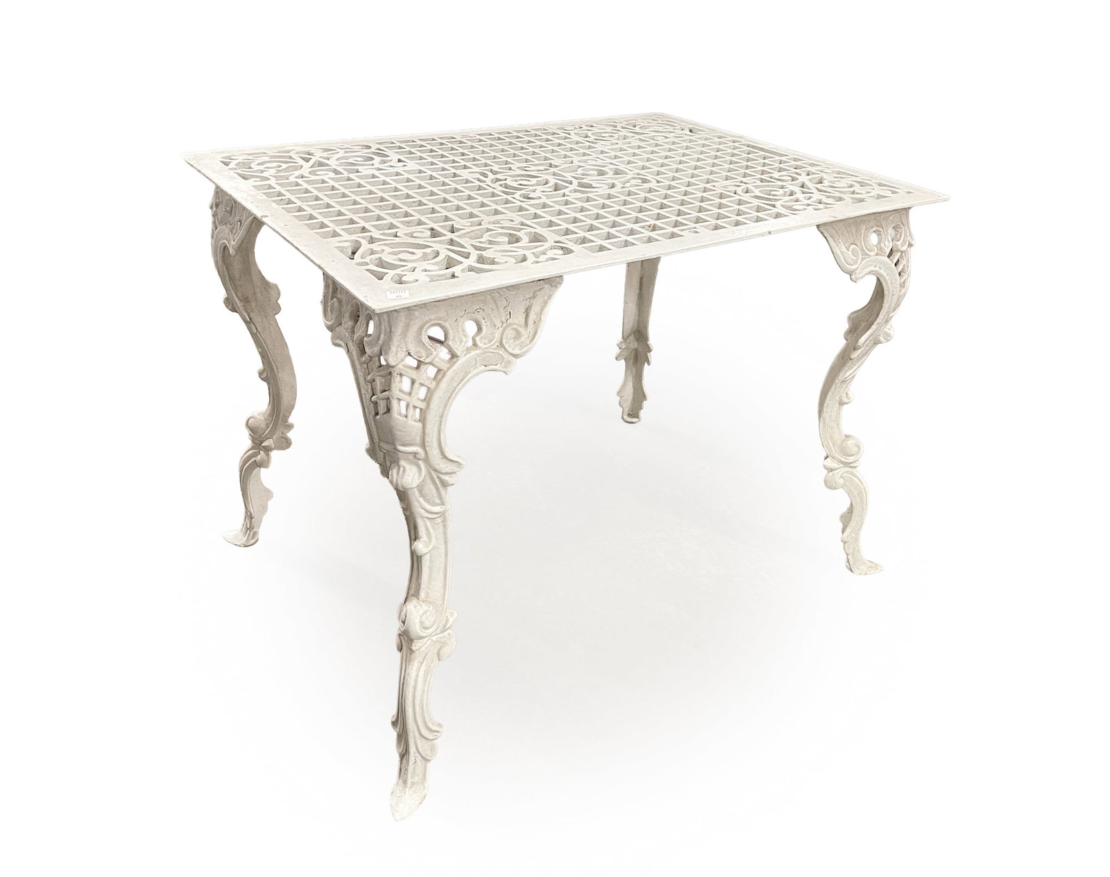 WHITE-PAINTED CAST IRON GRATE-TOP SIDE TABLE.: WHITE-PAINTED CAST IRON GRATE-TOP SIDE TABLE. Having a rectangular, floor grate top above four cabriole legs, 24"h. 31"w. 23"d. Provenance: From the Lifetime Collection of Marilyn and the late Jack Re