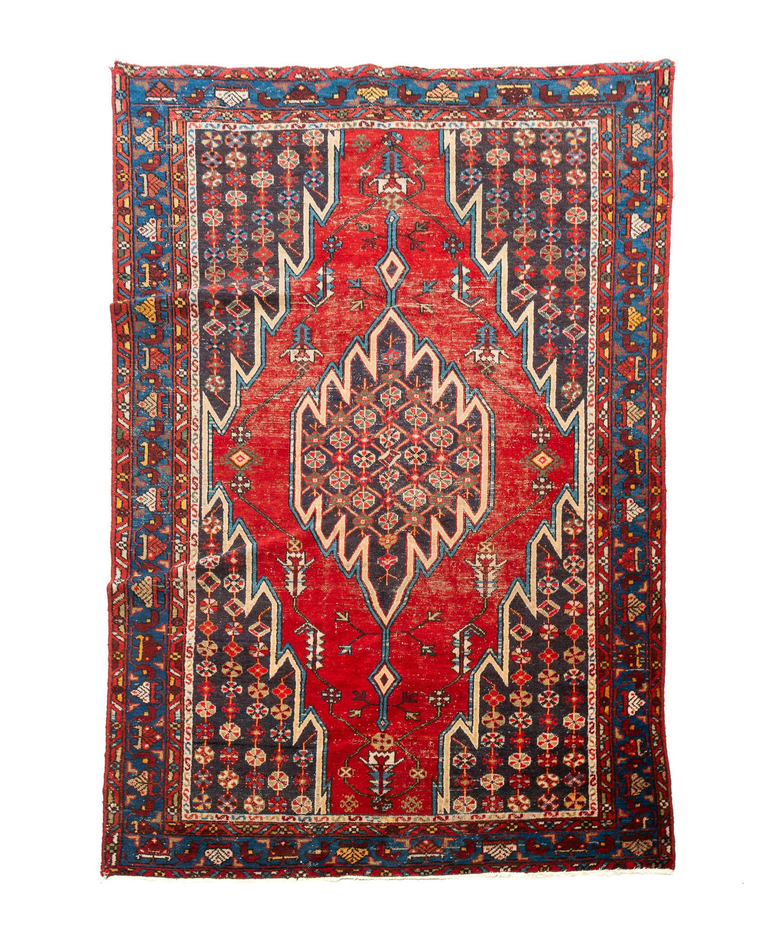 PERSIAN LIGHTNING HAMADAN HAND-KNOTTED WOOL AREA RUG.: PERSIAN LIGHTNING HAMADAN HAND-KNOTTED WOOL AREA RUG. Iran, 20th Century. Having a central polychrome staggered medallion with pinwheels on a polychrome field of stylized floral and foliate motifs, on