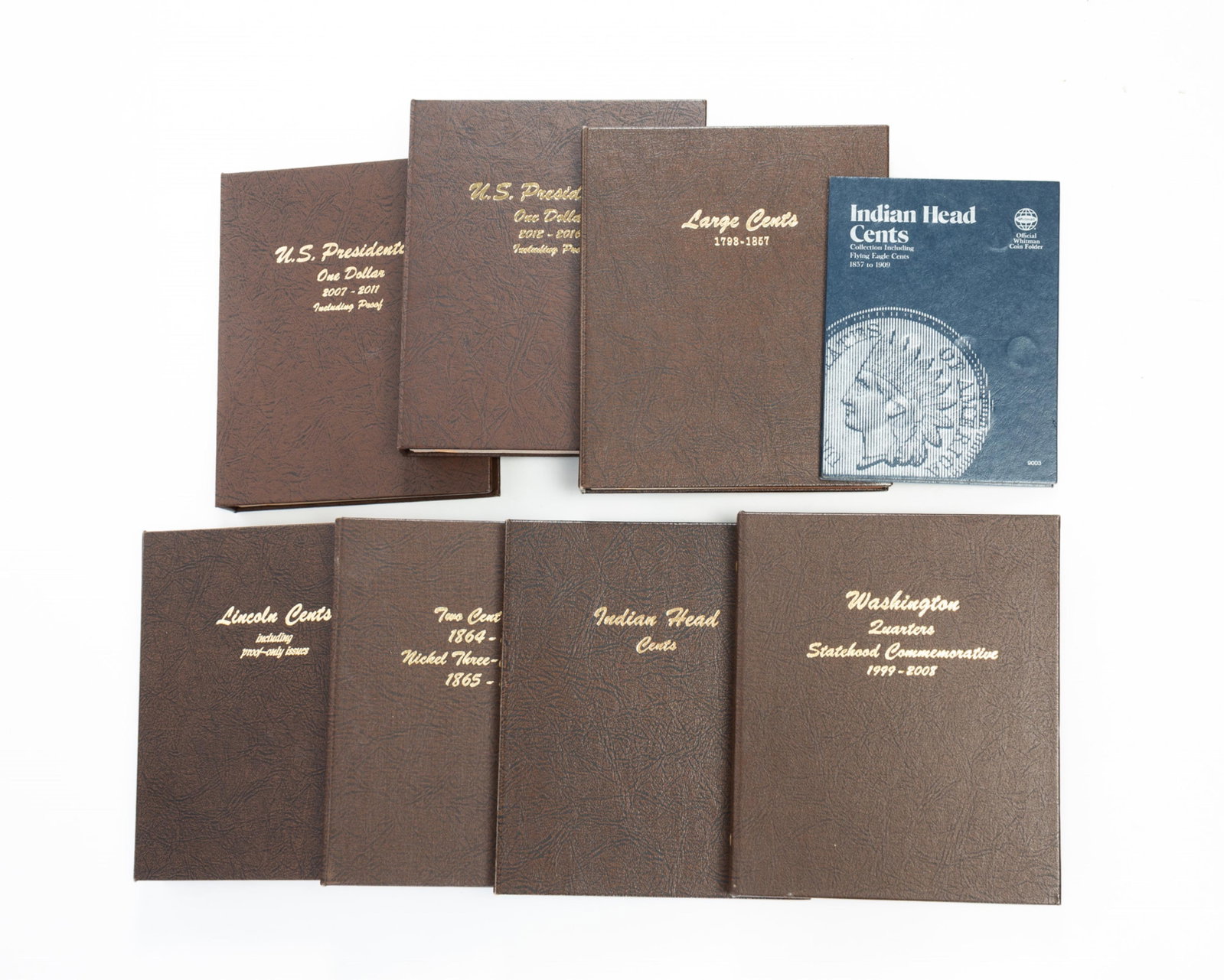 GROUP OF U.S. COIN COLLECTOR ALBUMS INCLUDING LARGE CENTS, PRESIDENTIAL DOLLARS, AND INDIAN HEAD: GROUP OF U.S. COIN COLLECTOR ALBUMS INCLUDING LARGE CENTS, PRESIDENTIAL DOLLARS, AND INDIAN HEAD CENTS. American. Includes two Presidential Dollar albums, a Large Cent album partially filled, a full
