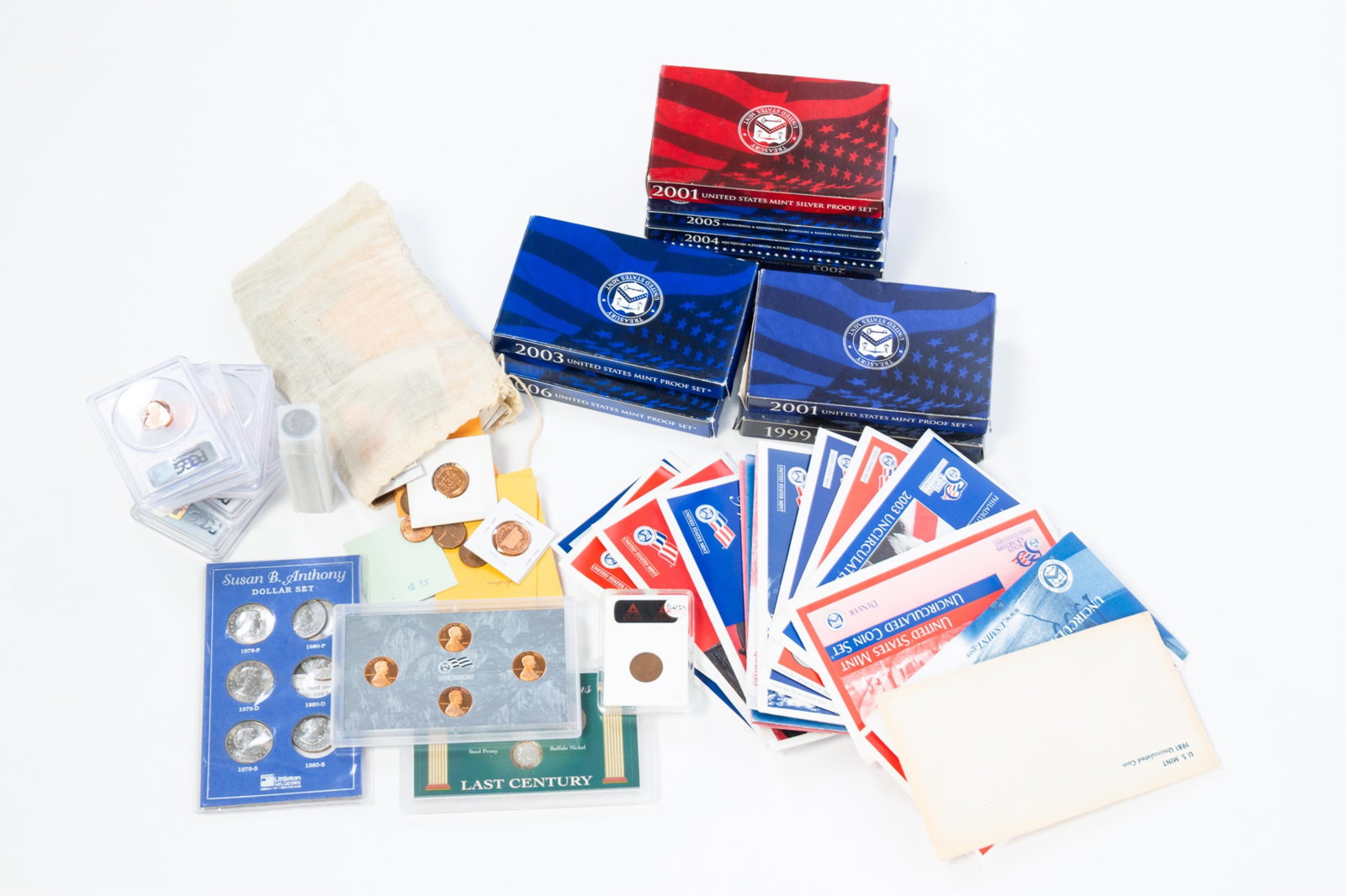 GROUP OF U.S. MINT CENTS AND LOOSE COINS.: GROUP OF U.S. MINT CENTS AND LOOSE COINS. American. Mostly mint proof sets from the 2000s, along with a large group of loose coins, Lincoln cents, a few slabbed cents, including a 1955 one-cent