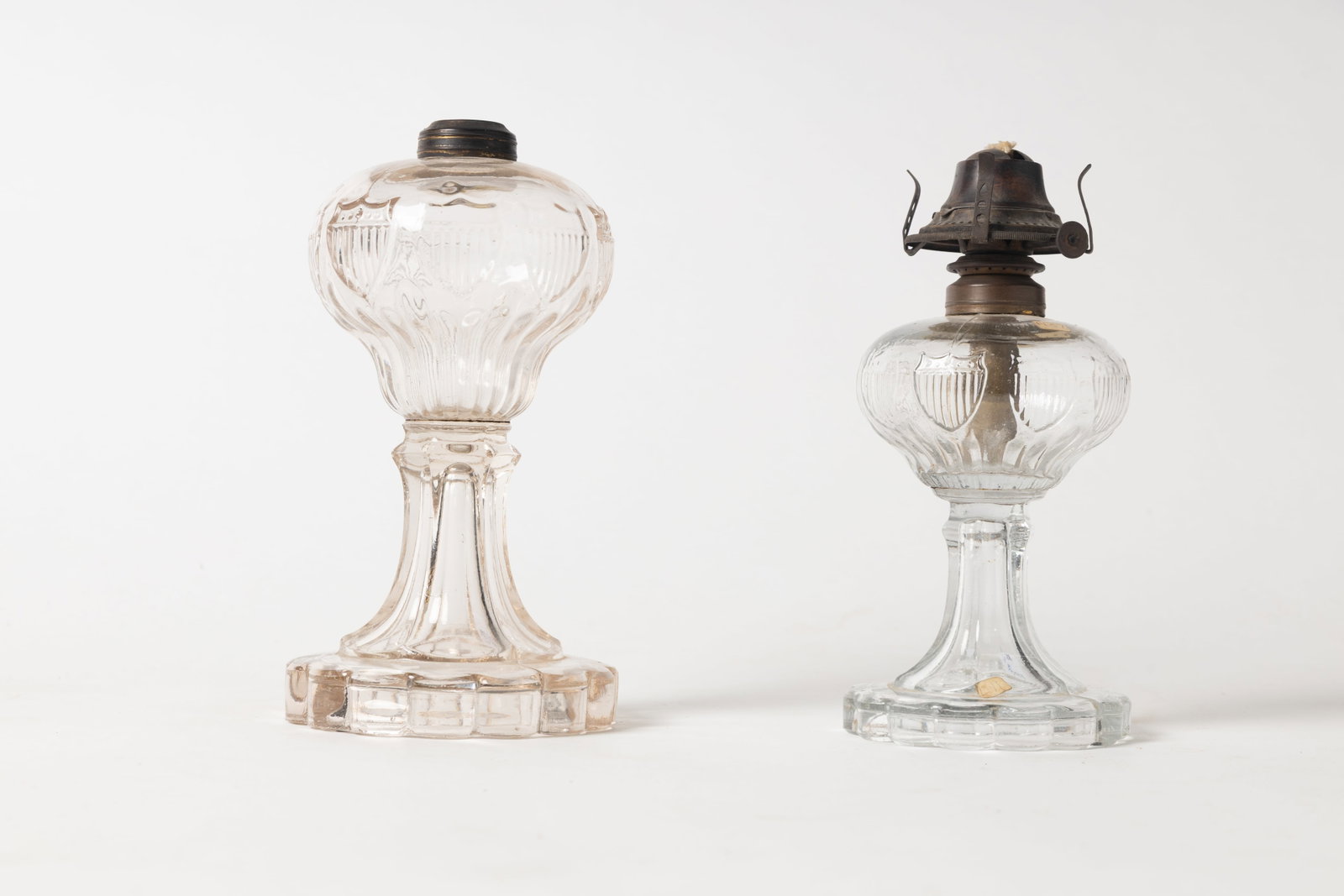 TWO BAKEWELL (PITTSBURGH, PENNSYLVANIA) FLINT GLASS OIL LAMPS WITH SHIELD FONTS. (1 of 8)