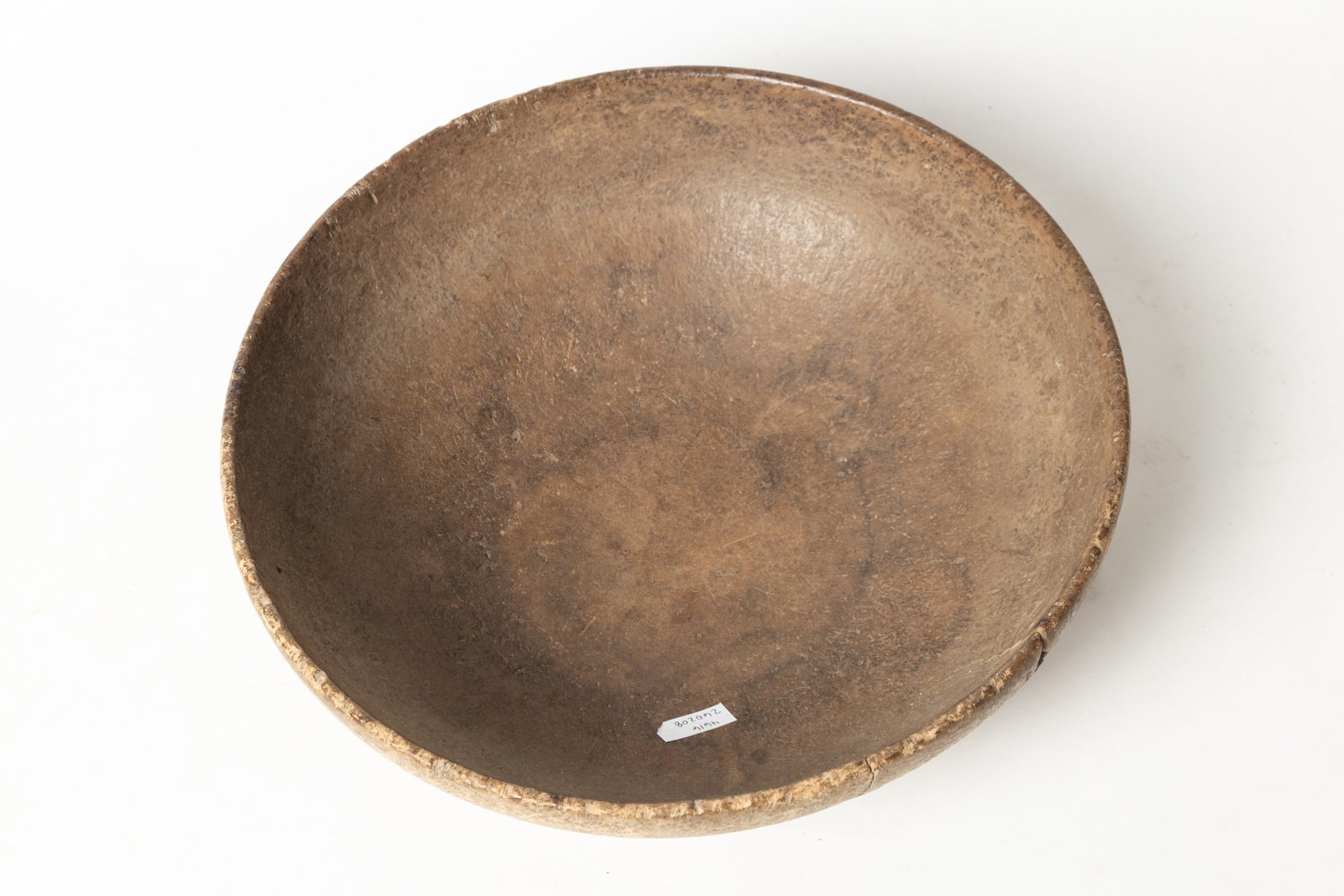 NORTHEASTERN WOODLANDS ASH BURL BOWL.: NORTHEASTERN WOODLANDS ASH BURL BOWL. Native American, late 18th Century. Carved bowl in the round with wide base. Thinly hewn with great dry surface. 4.25"h. 13"d. Provenance: Nancy Goff (Alliance, O