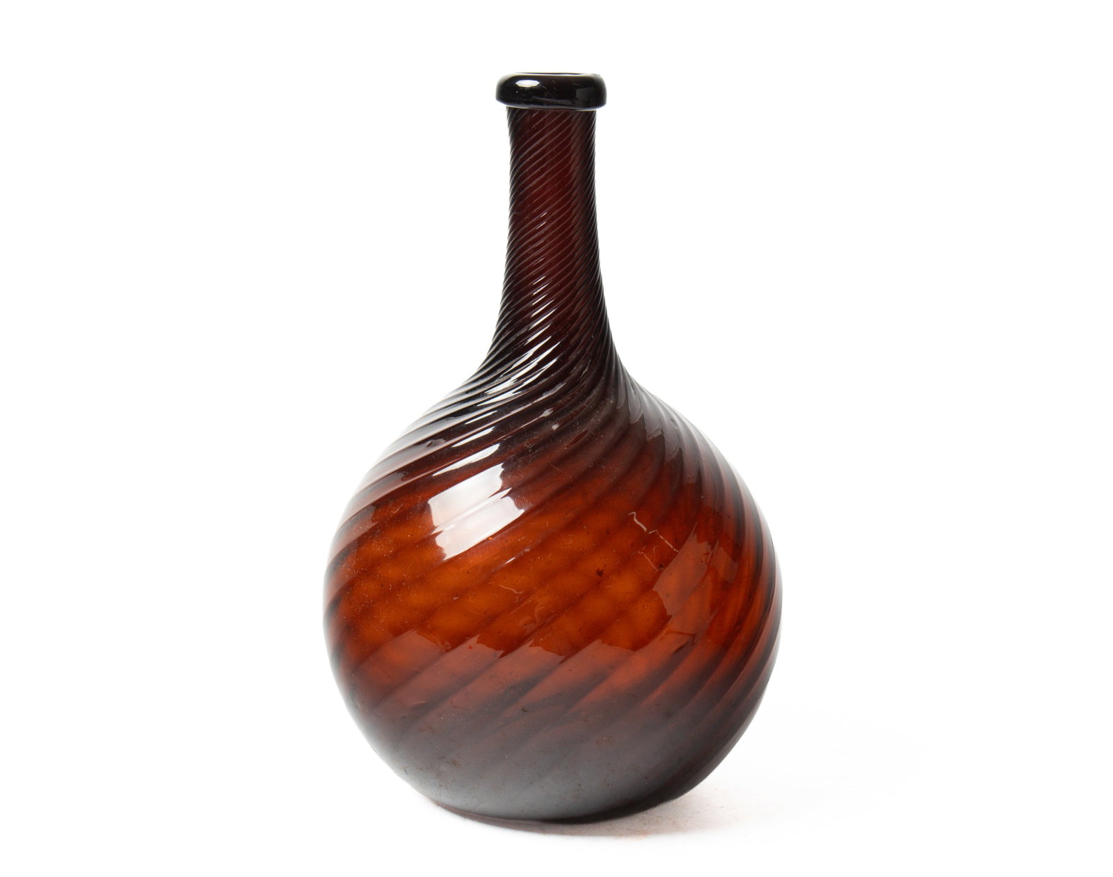 ZANESVILLE SWIRL DARK AMBER GLASS BOTTLE. (1 of 2)