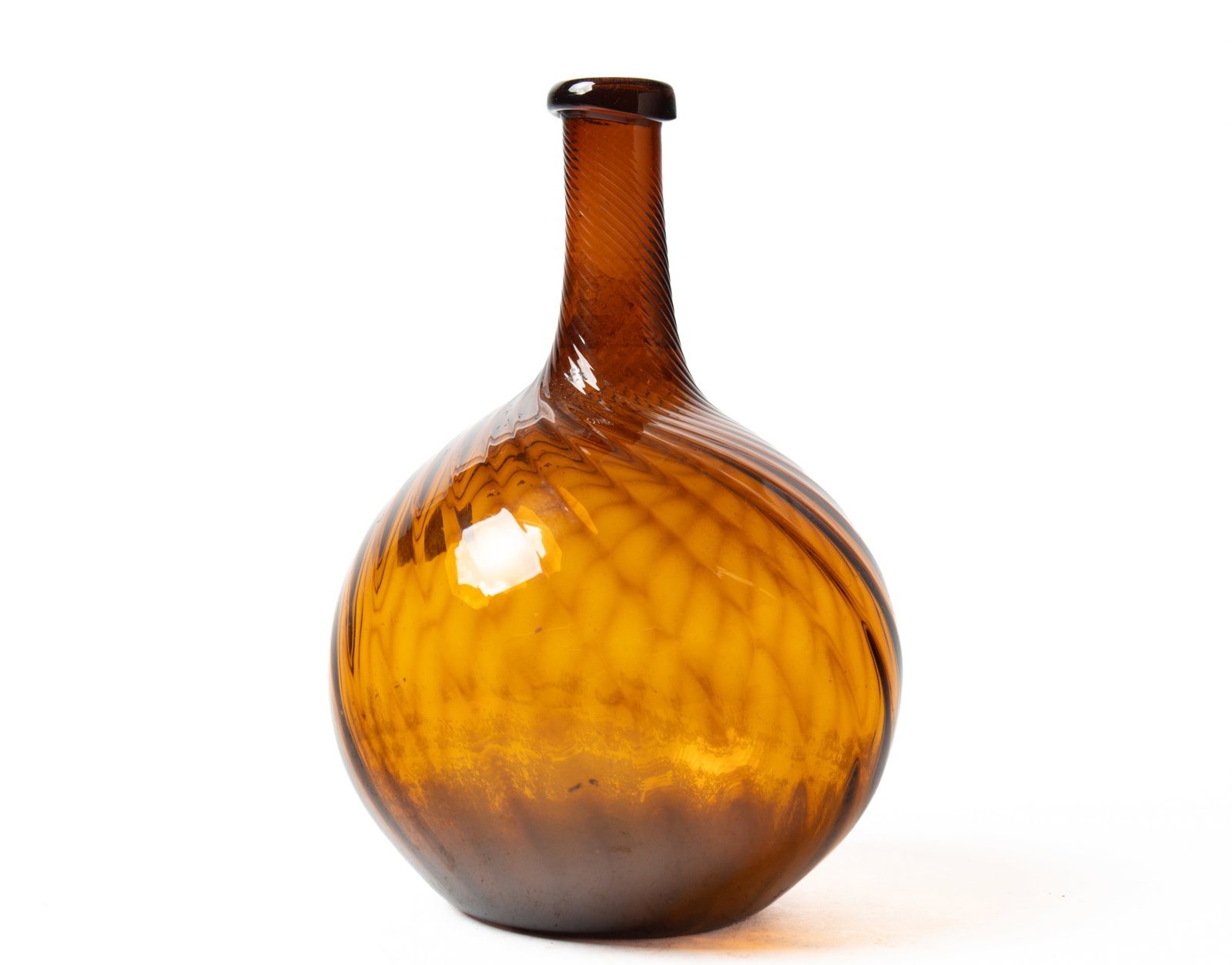 ZANESVILLE SWIRL AMBER GLASS BOTTLE. (1 of 3)