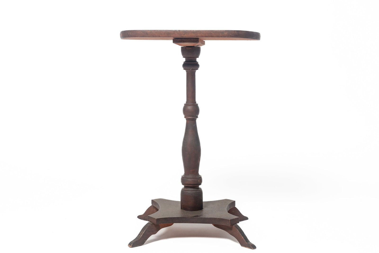 FOLKSY ZOAR, OHIO CANDLESTAND.: FOLKSY ZOAR, OHIO CANDLESTAND. American, 19th Century. Rounded rectangular top, central turned column on a platform quadrifoil base with concave sides, and shaped legs. Wonderful bittersweet paint to