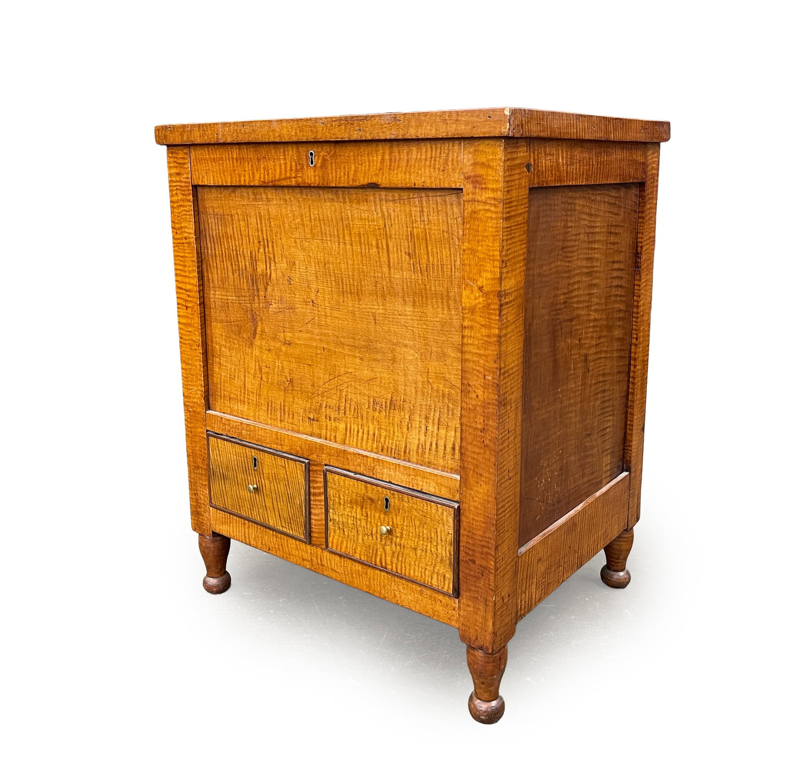 SHERATON STYLE TIGER MAPLE SUGAR CHEST.: SHERATON STYLE TIGER MAPLE SUGAR CHEST. American, 20th Century. Lid with applied edge moldings, paneled sides and front, two lower dovetailed drawers with applied beaded edges and turned legs. 30"h. 2