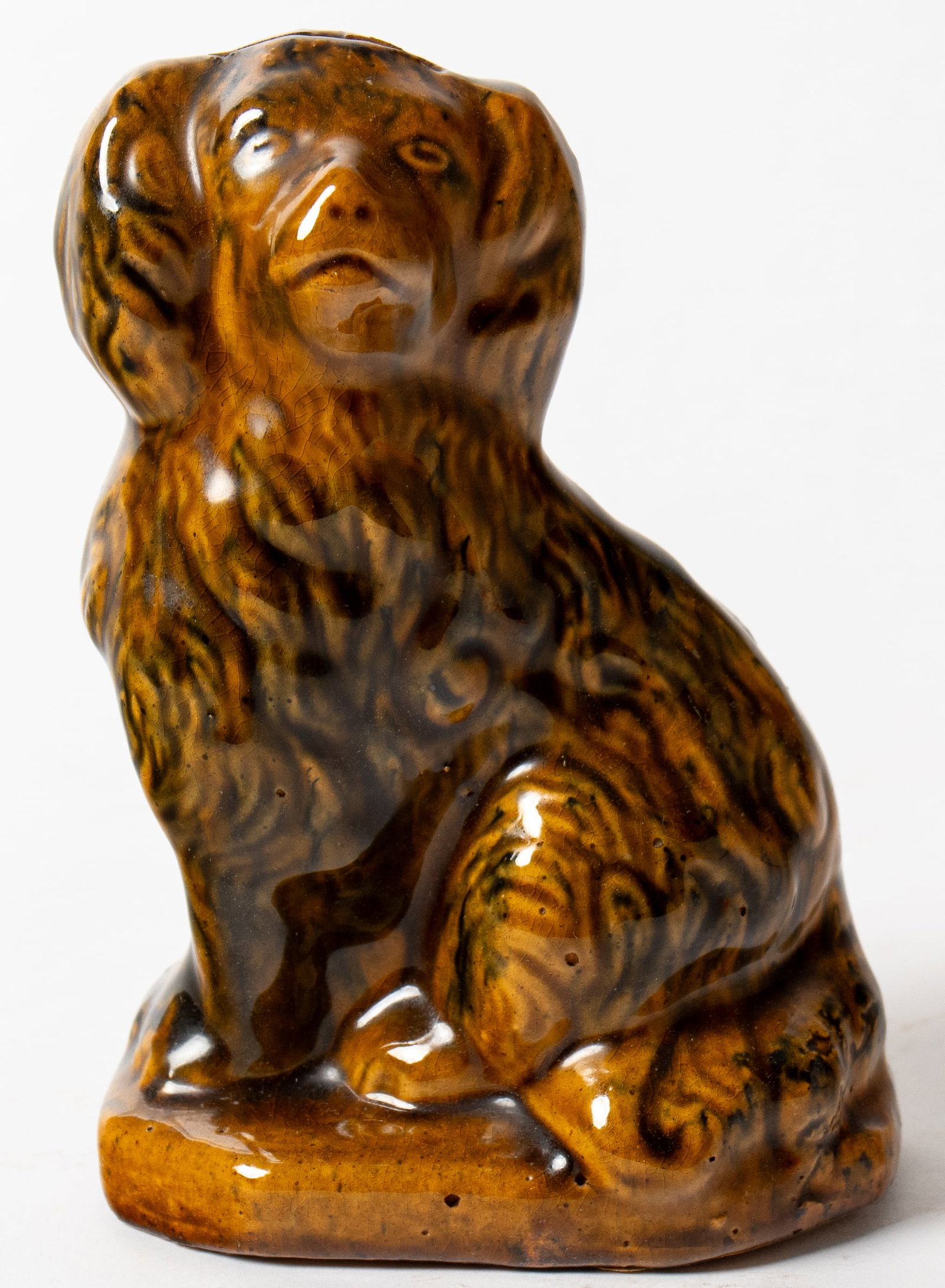 FINE DIMINUTIVE EAST LIVERPOOL, OHIO GLAZED BUFF CLAY SEATED SPANIEL BANK. (1 of 6)