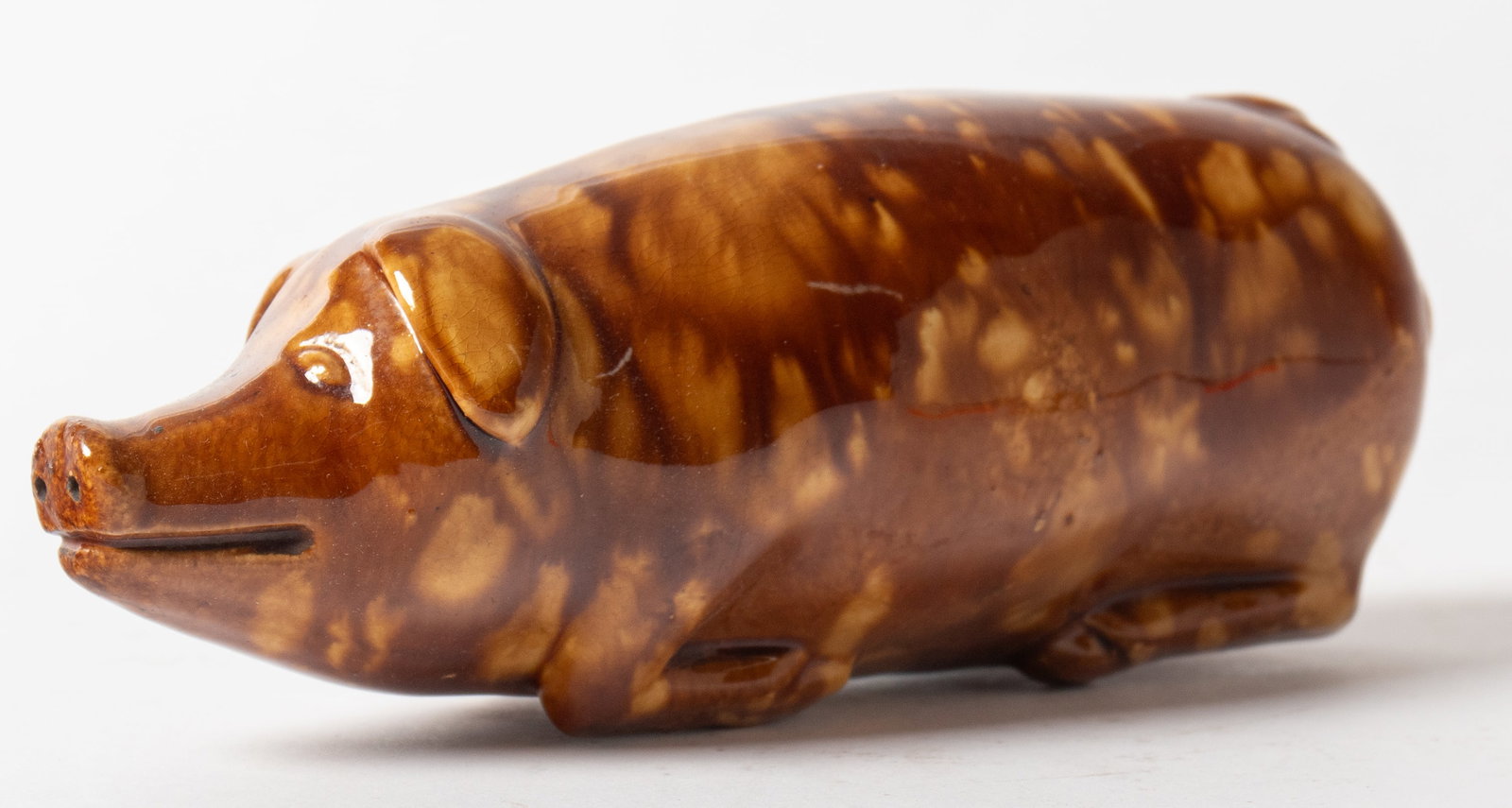 YELLOWWARE PIG FLASK WITH ROCKINGHAM GLAZE. (1 of 5)