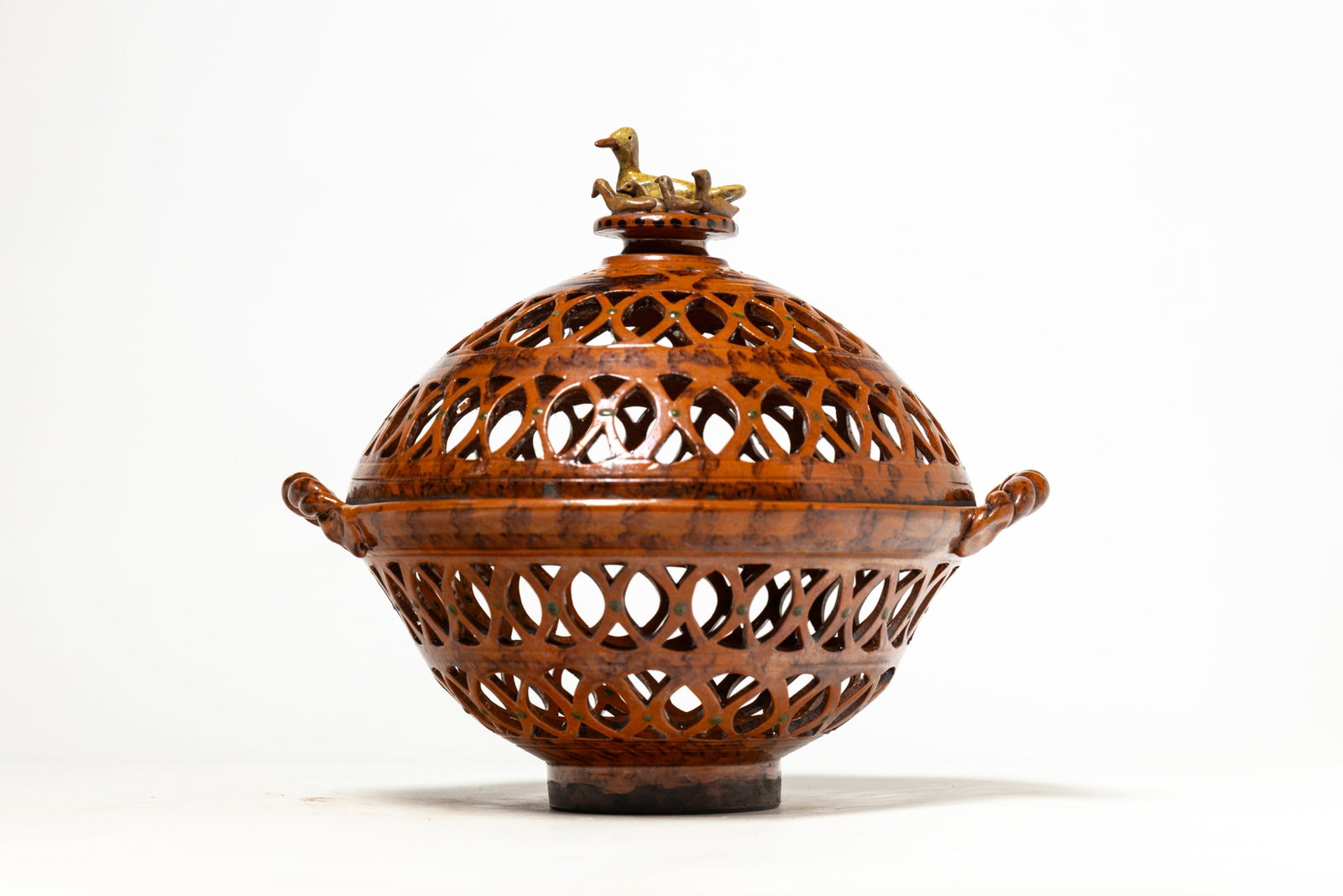 GREG SHOONER (OREGONIA, OHIO, B. 1953) GLAZED REDWARE POTTERY PIERCED BOWL WITH LID DATED 2010. (1 of 6)