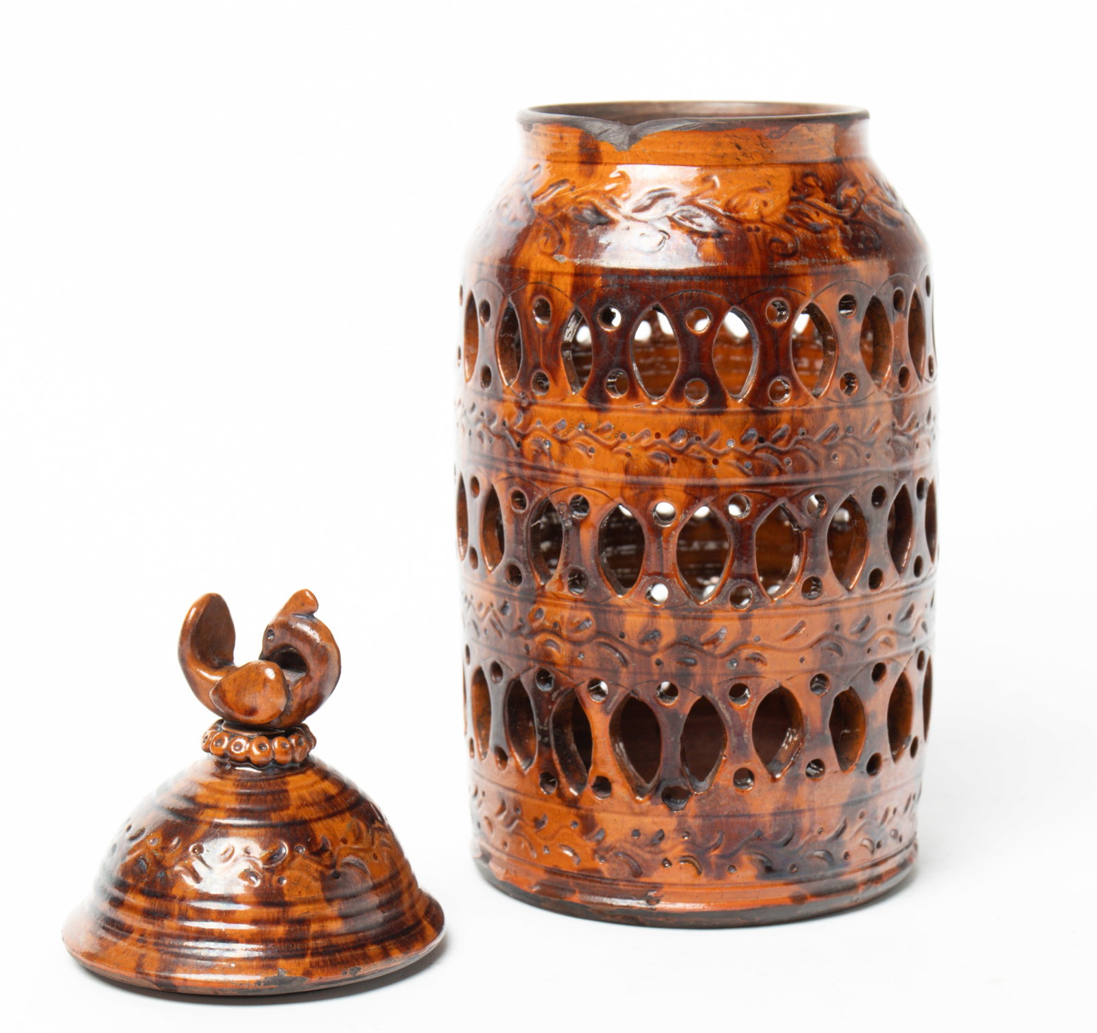 GREG SHOONER (OREGONIA, OHIO, B. 1953) GLAZED REDWARE POTTERY PIERCED JAR WITH LID DATED 2008. (1 of 4)